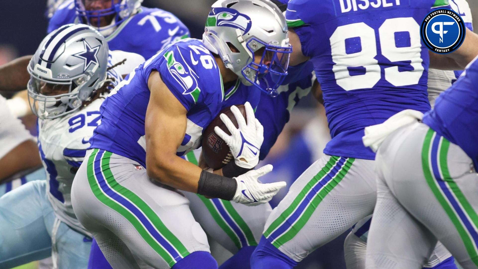 Seattle Seahawks running back Zach Charbonnet (26) runs the ball against the Dallas Cowboys during the first half at AT&T Stadium.