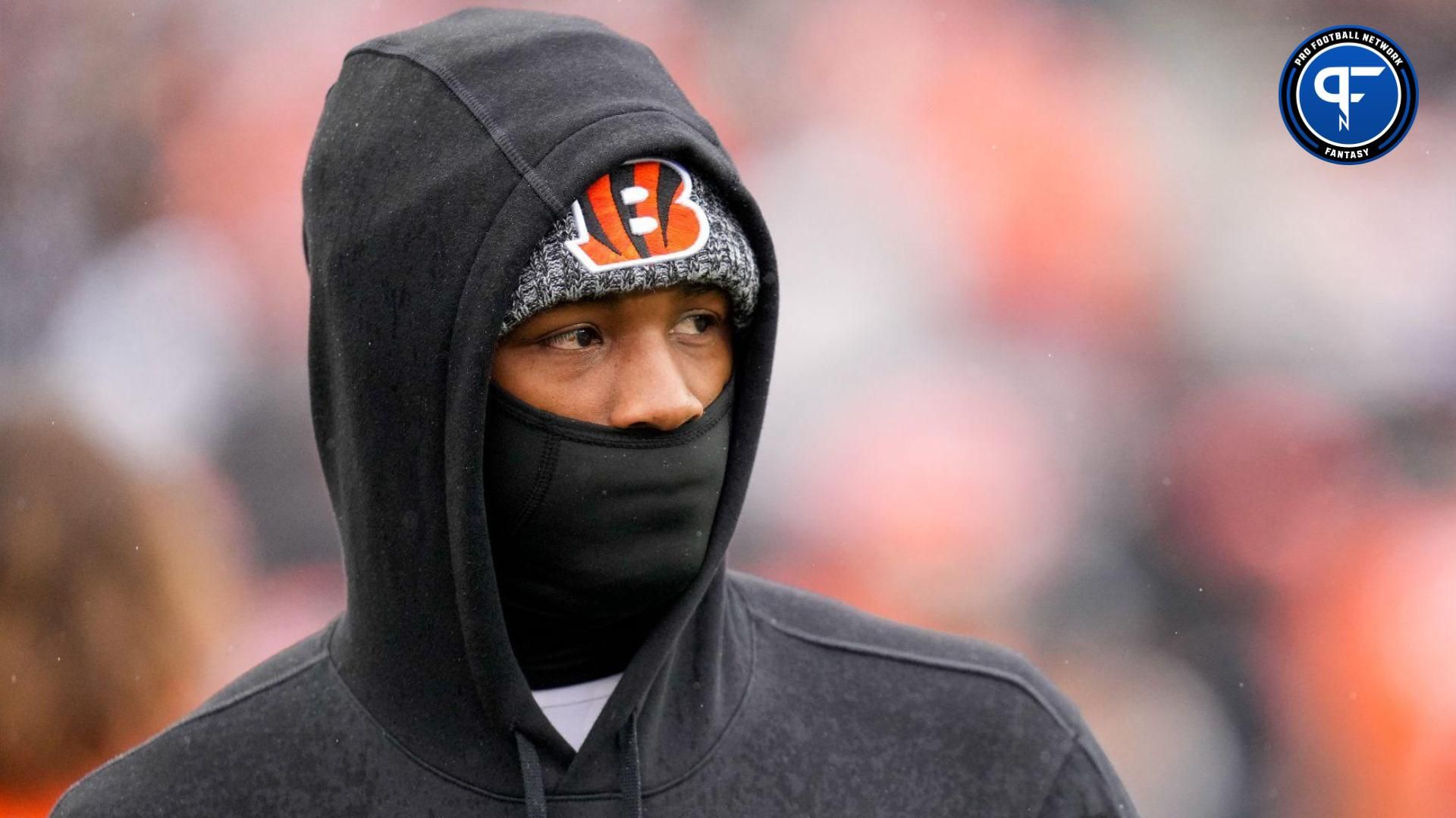 Injured Cincinnati Bengals wide receiver Tee Higgins (5) walks the sideline in the first quarter of the NFL Week 12 game between the Cincinnati Bengals and the Pittsburgh Steelers at Paycor Stadium in Cincinnati on Sunday, Nov. 26, 2023.