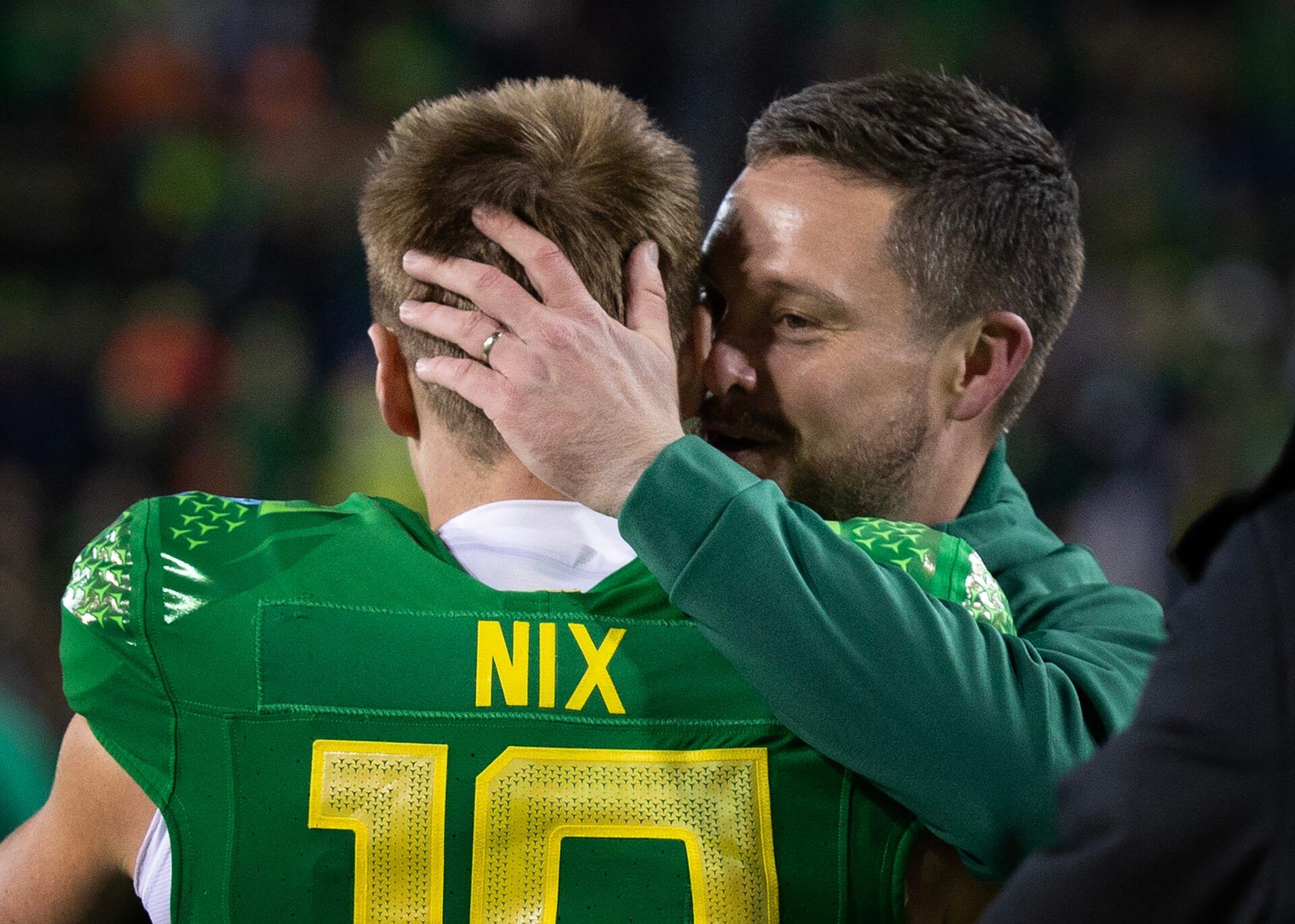 Oregon s Bo Nix and coach Dan Lanning embrace before the game against Oregon State at Autzen Stadium Friday, Nov. 24, 2023.