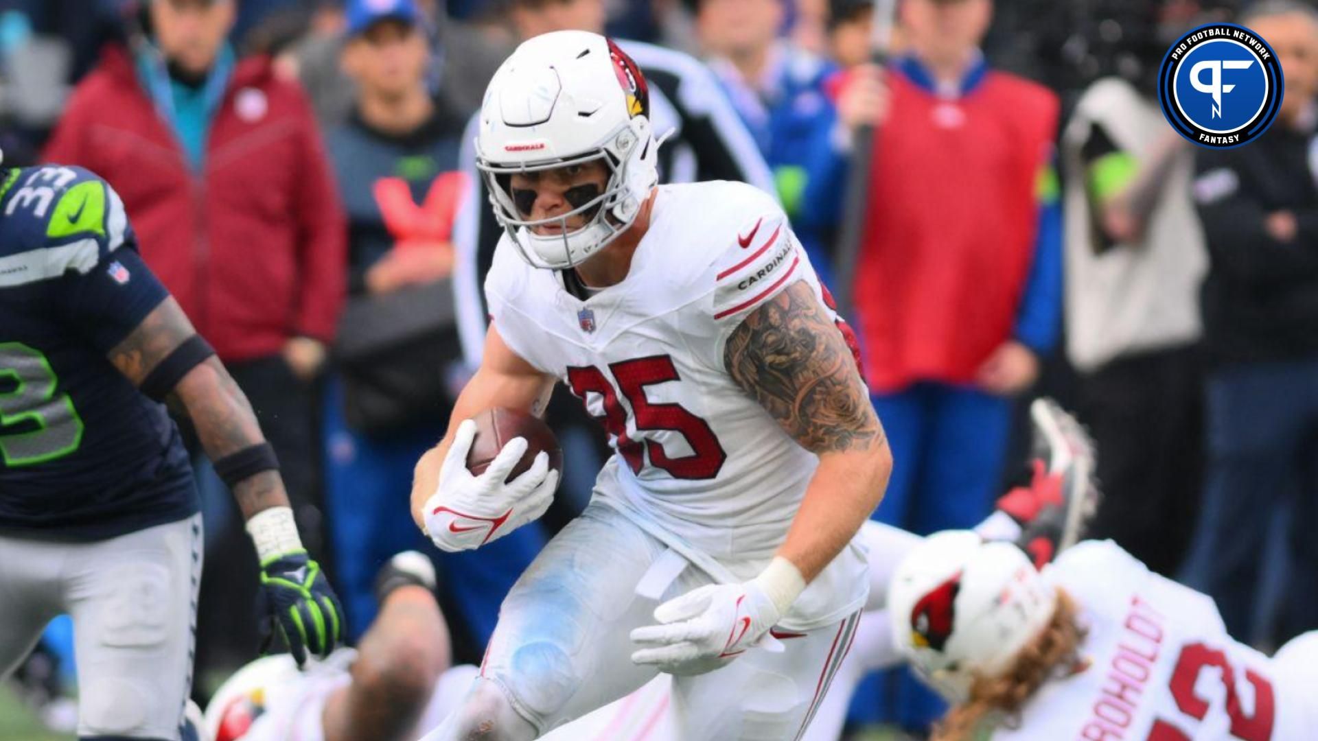 Arizona Cardinals tight end Trey McBride (85) carries the ball against the Seattle Seahawks during the second half at Lumen Field.