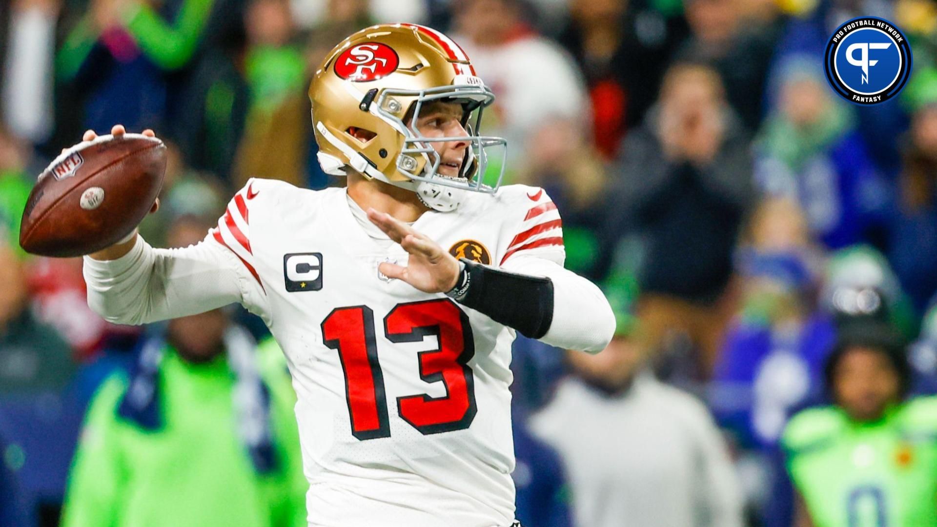 San Francisco 49ers quarterback Brock Purdy (13) passes against the Seattle Seahawks during the second quarter at Lumen Field.