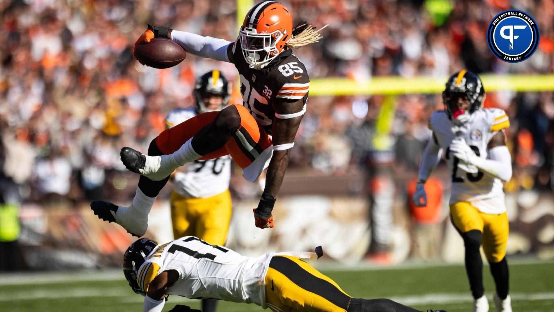 Cleveland Browns tight end David Njoku (85) leaps over Pittsburgh Steelers safety Trenton Thompson (17) during the first quarter at Cleveland Browns Stadium.