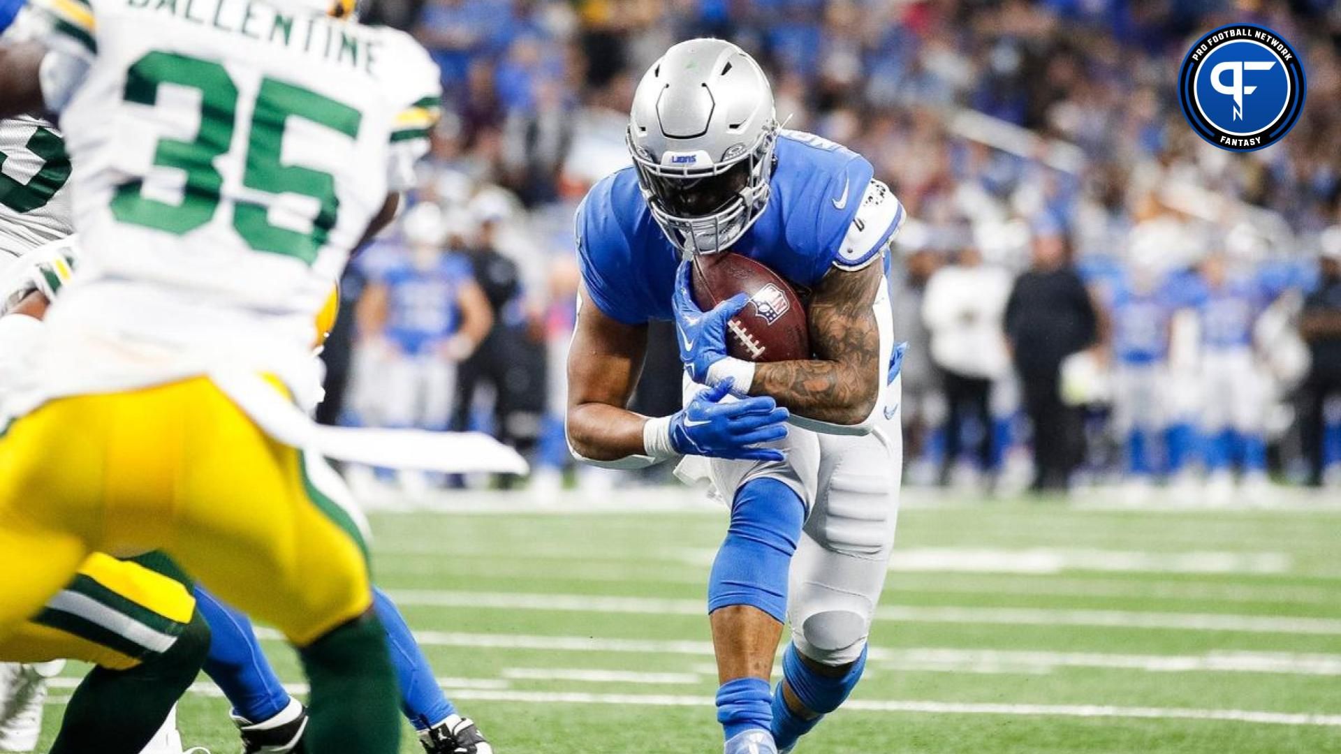 David Montgomery leans toward the goal line against the Green Bay Packers during the second half at Ford Field.