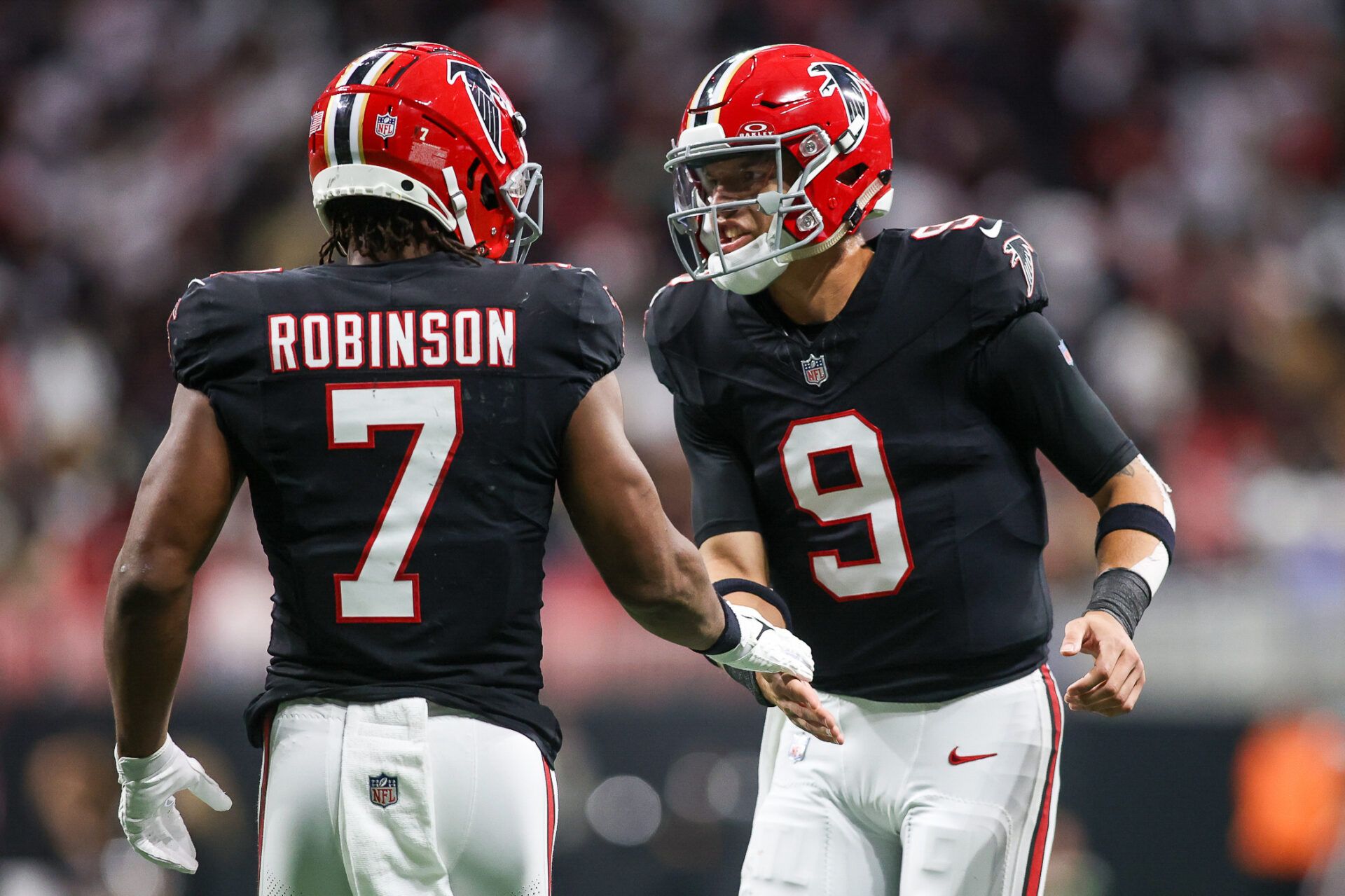 Atlanta Falcons running back Bijan Robinson (7) celebrates after a touchdown with quarterback Desmond Ridder (9) against the New Orleans Saints in the second quarter at Mercedes-Benz Stadium.