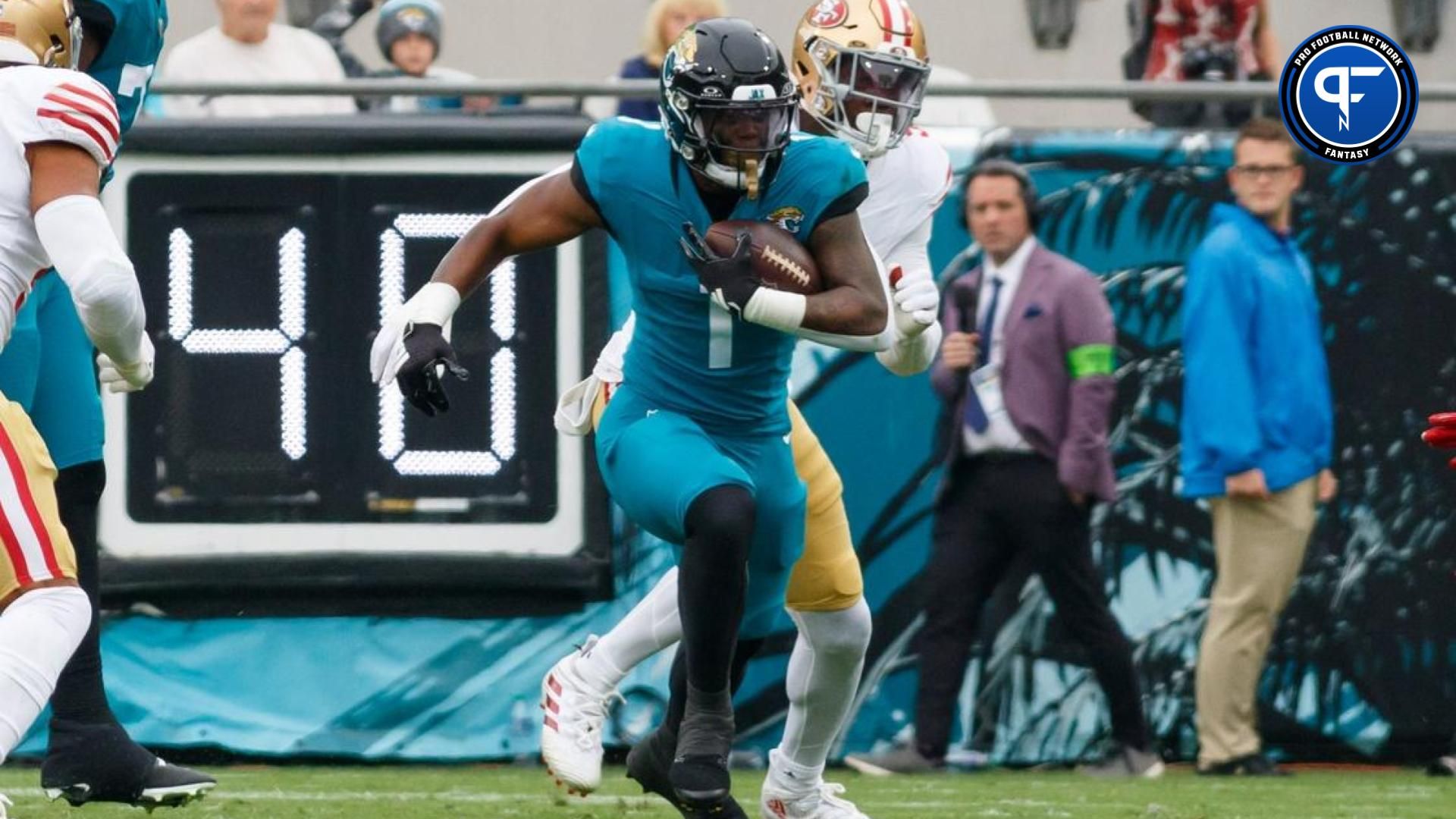 Travis Etienne Jr. (1) runs with the ball against San Francisco 49ers during the second quarter at EverBank Stadium.