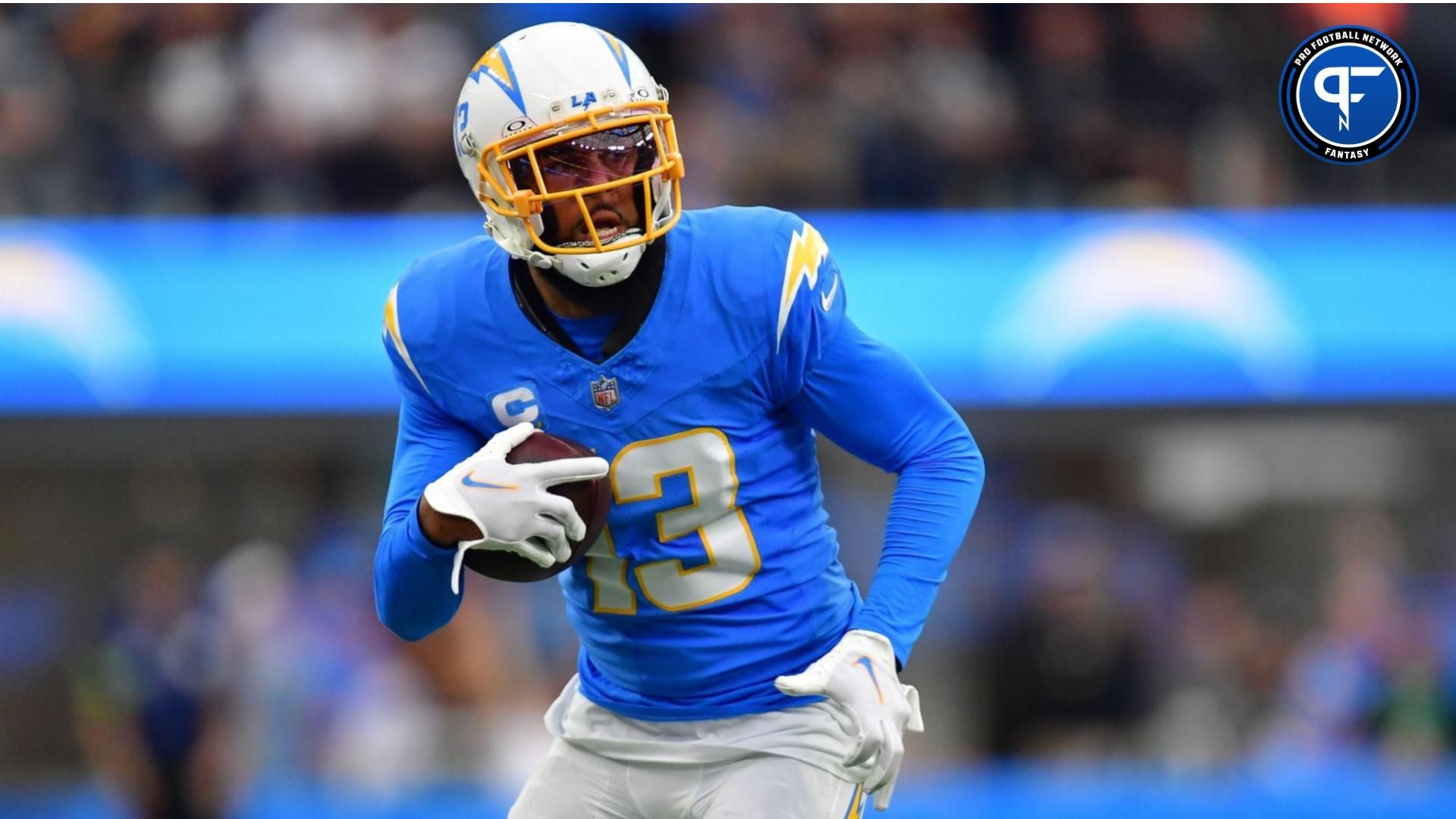 Los Angeles Chargers wide receiver Keenan Allen (13) runs the ball against the Las Vegas Raiders during the first half at SoFi Stadium.