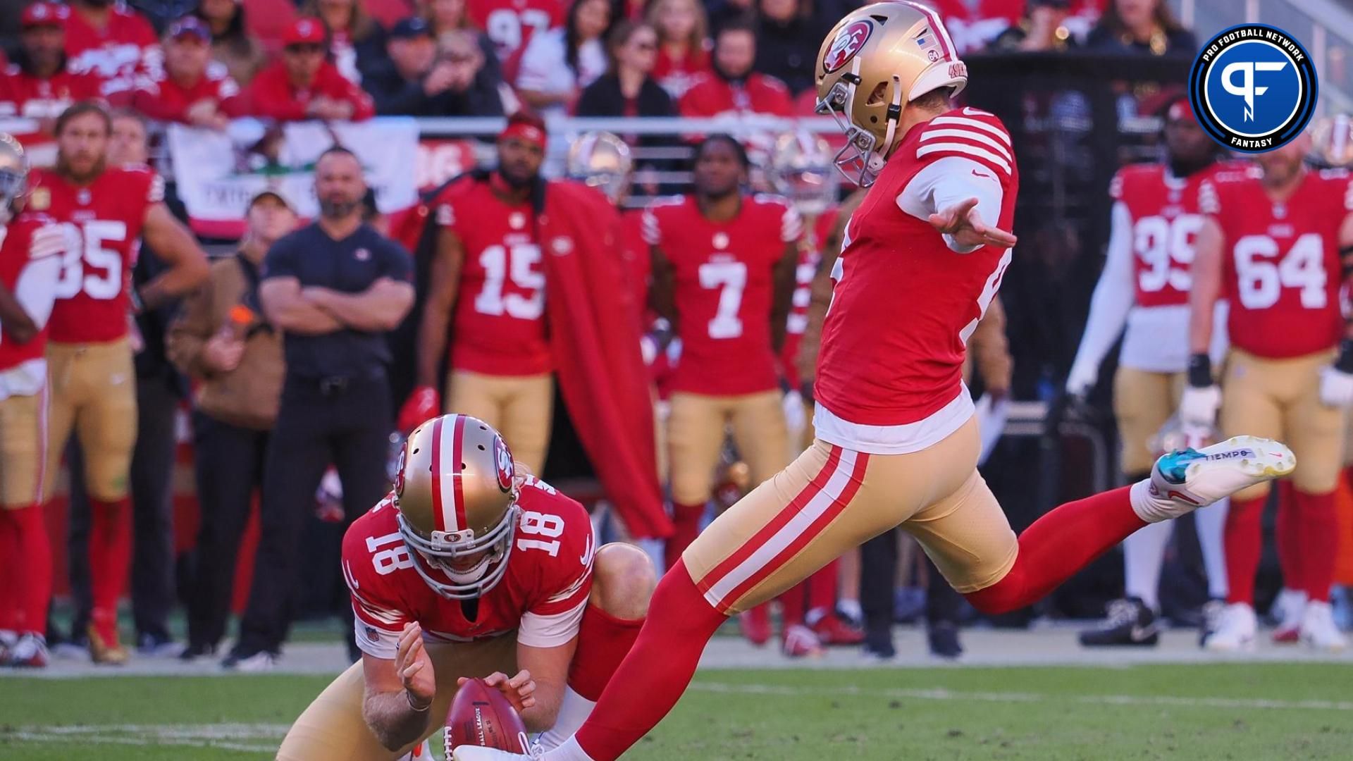 San Francisco 49ers kicker Jake Moody (4) kicks a field goal with a hold from punter Mitch Wishnowsky (18) during the second quarter at Levi's Stadium.