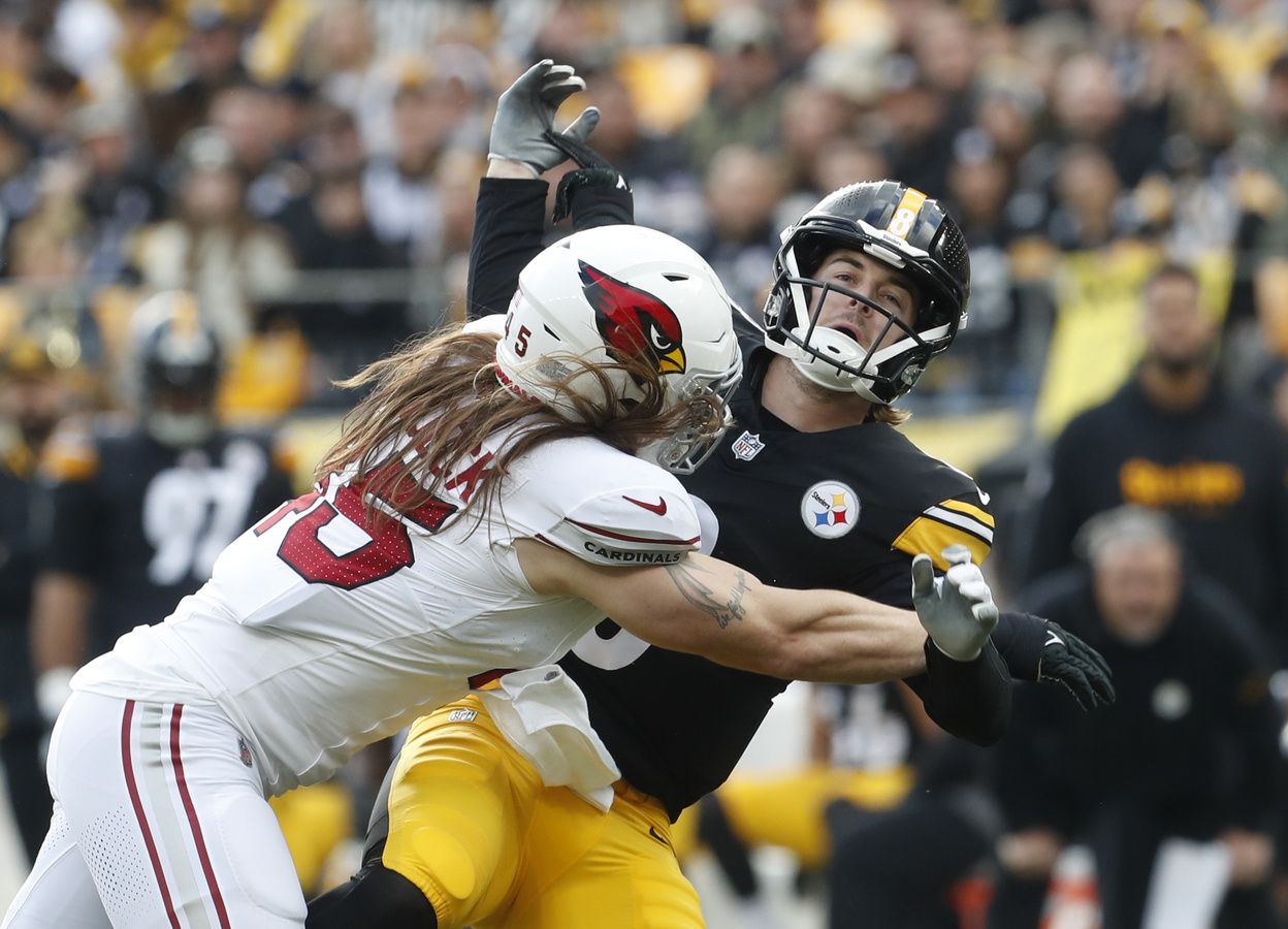 Arizona Cardinals linebacker Dennis Gardeck (45) hits Pittsburgh Steelers quarterback Kenny Pickett (8) as he releases the football.