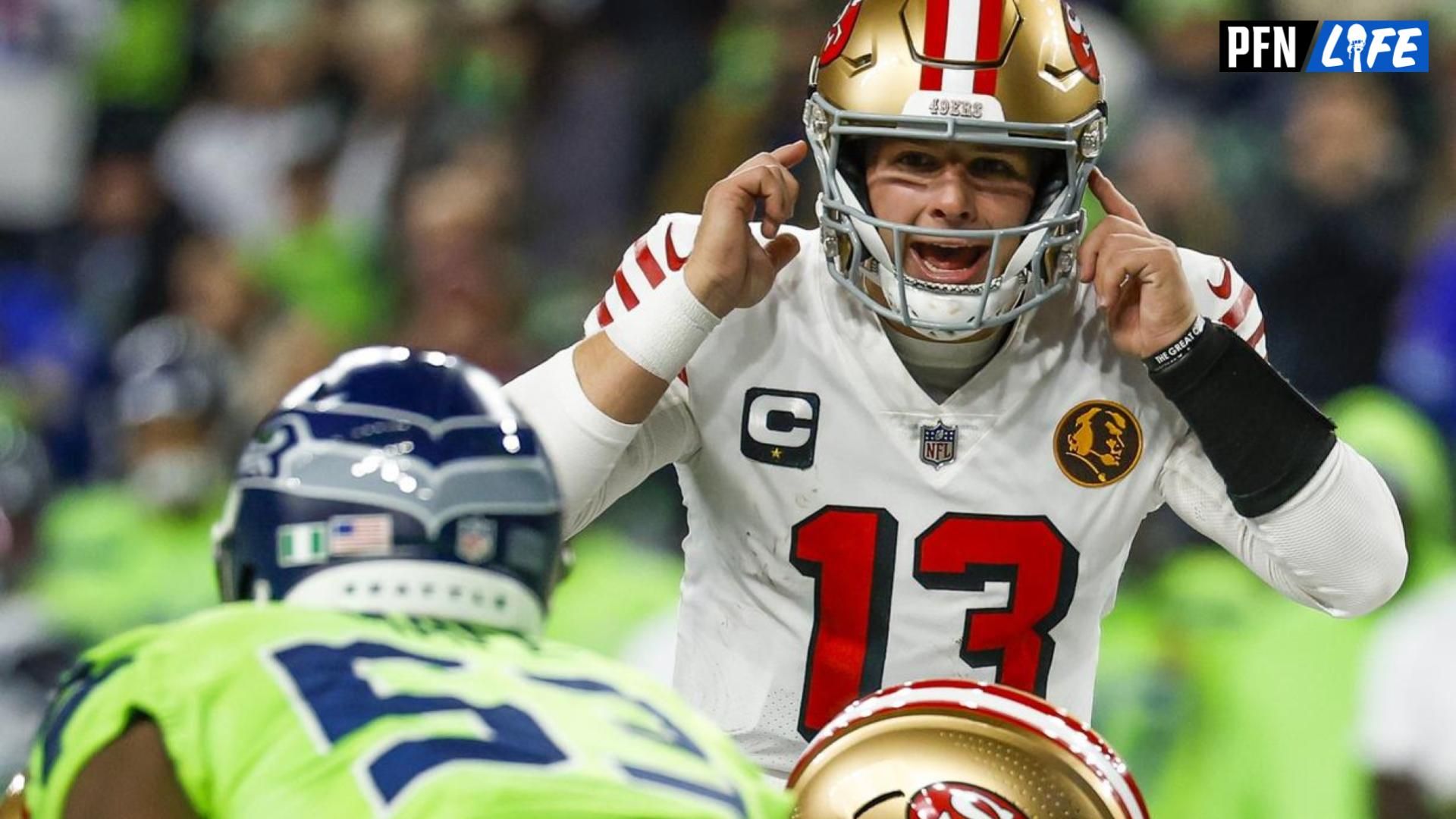 San Francisco 49ers QB Brock Purdy (13) signals against the Seattle Seahawks.