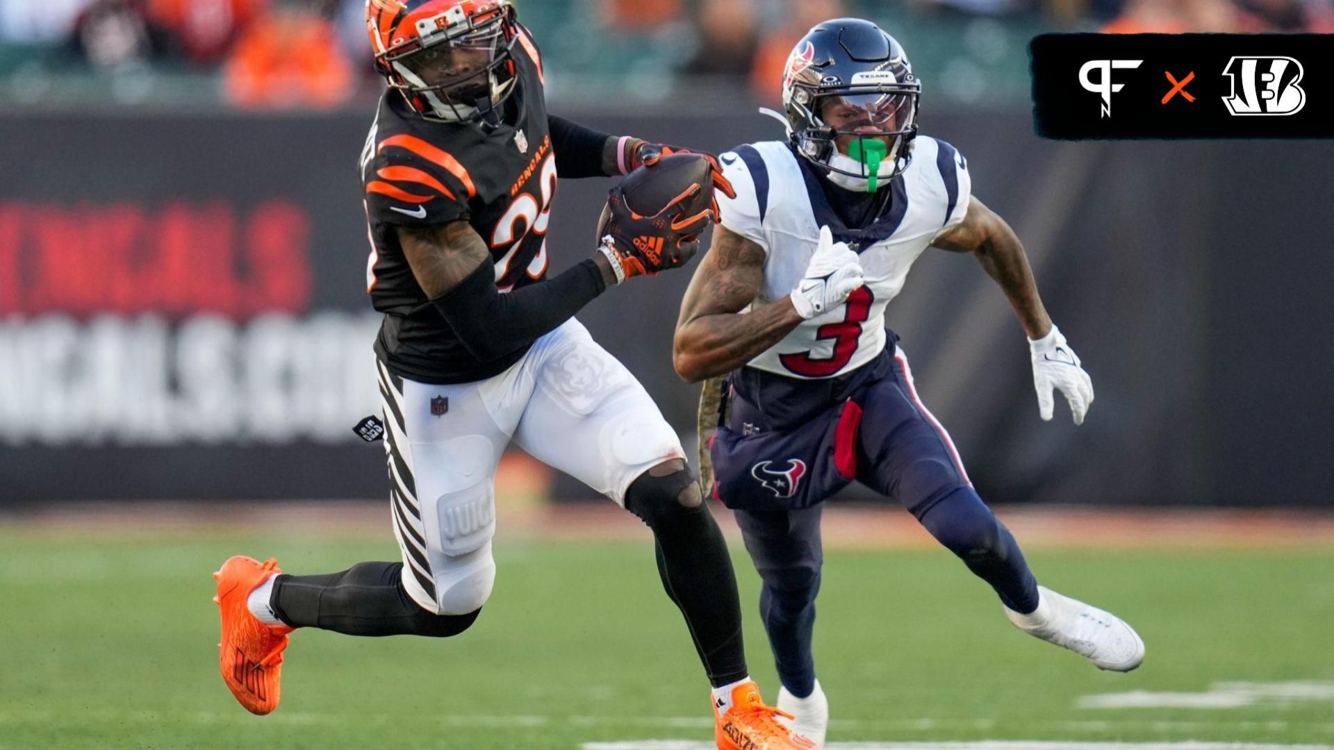 Cincinnati Bengals cornerback Cam Taylor-Britt (29) intercepts a pass intended for Houston Texans wide receiver Tank Dell (3).