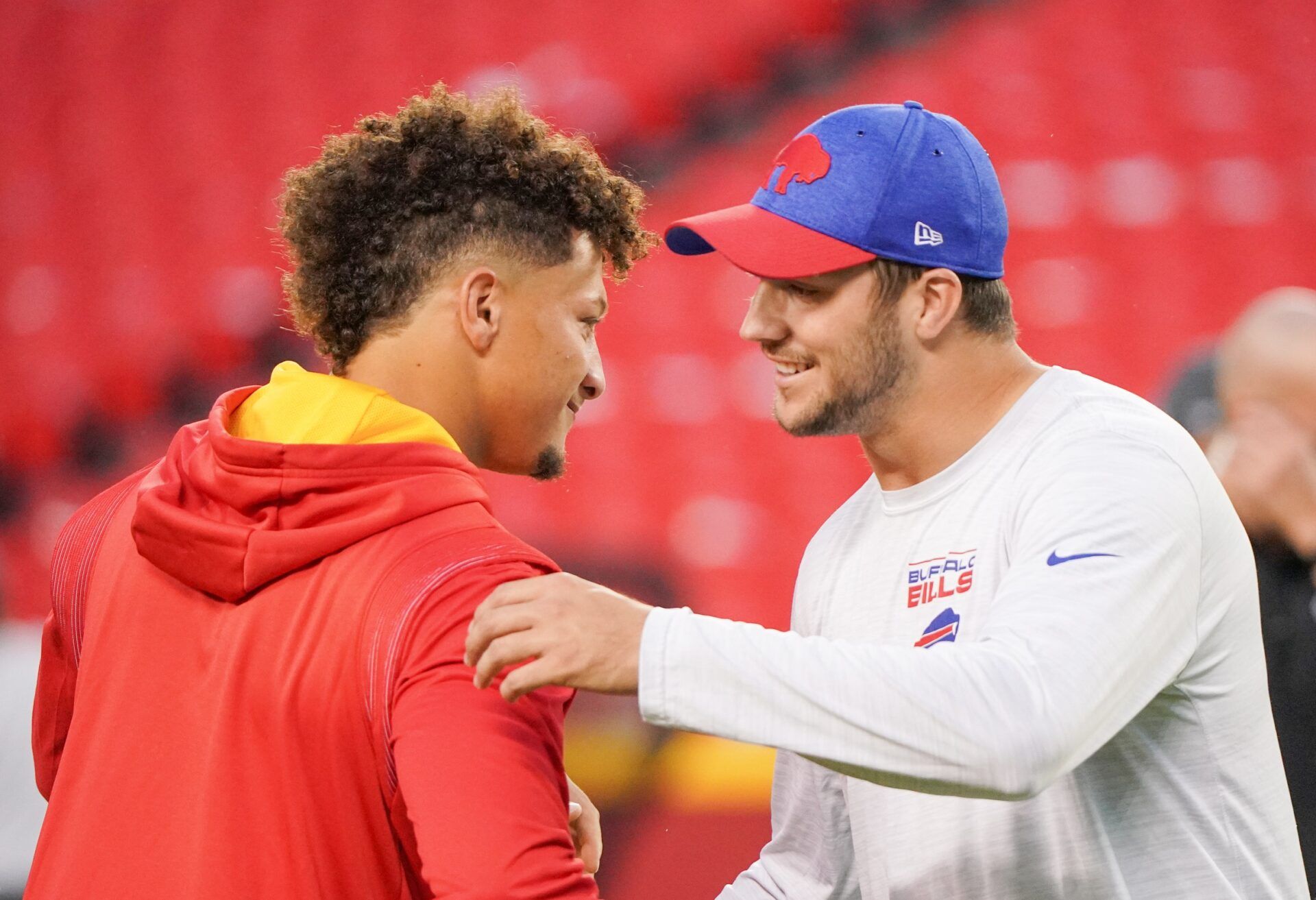 Patrick Mahomes (15) talks with Buffalo Bills quarterback Josh Allen (17) before warm ups at GEHA Field at Arrowhead Stadium.