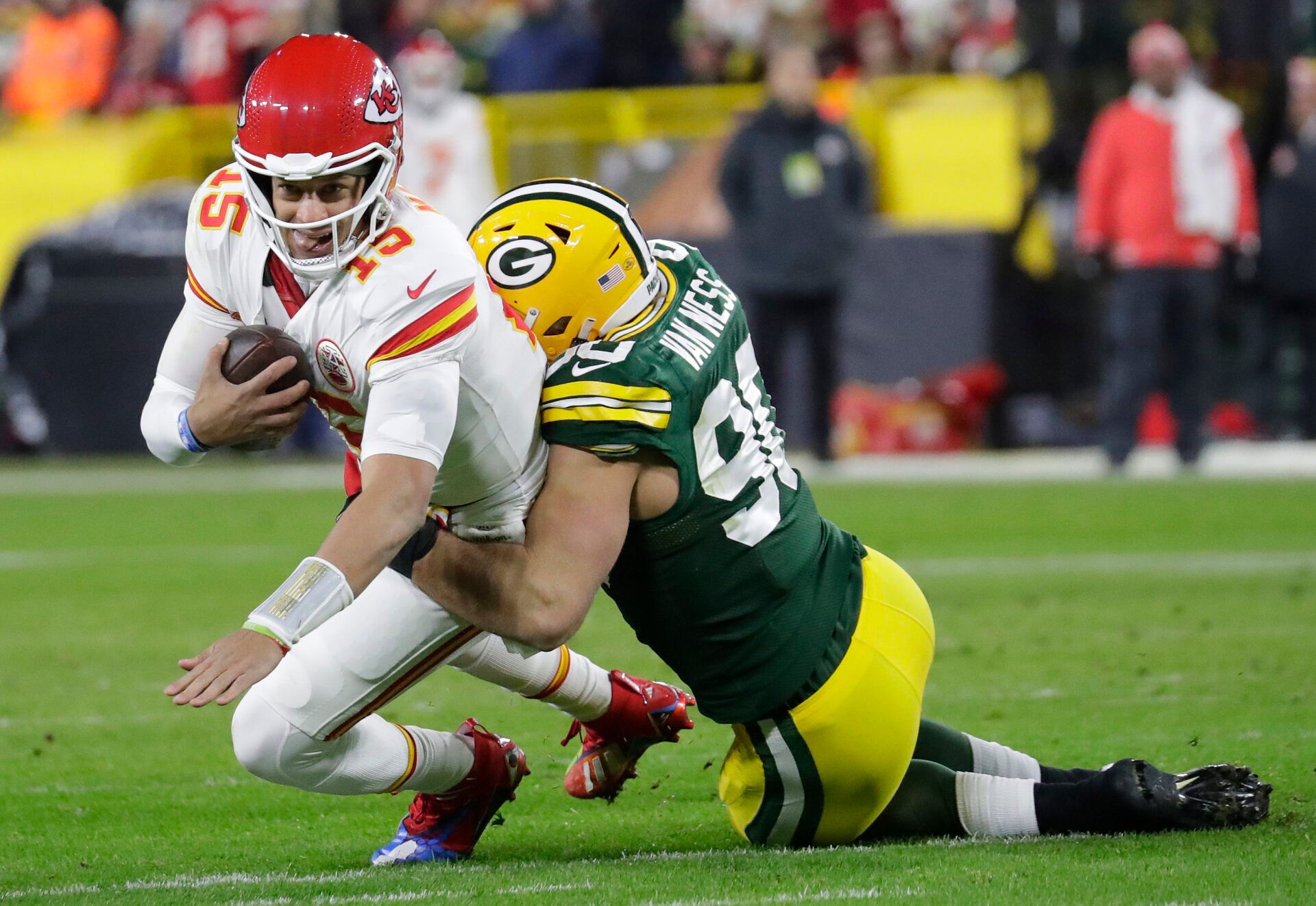 Green Bay Packers linebacker Lukas Van Ness (90) sacks Kansas City Chiefs quarterback Patrick Mahomes (15) at Lambeau Field.