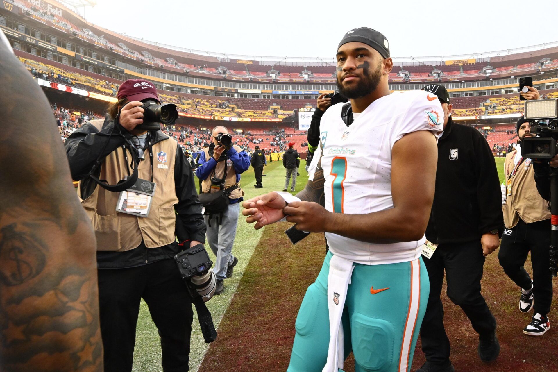 Tua Tagovailoa celebrates a big win against the Commanders