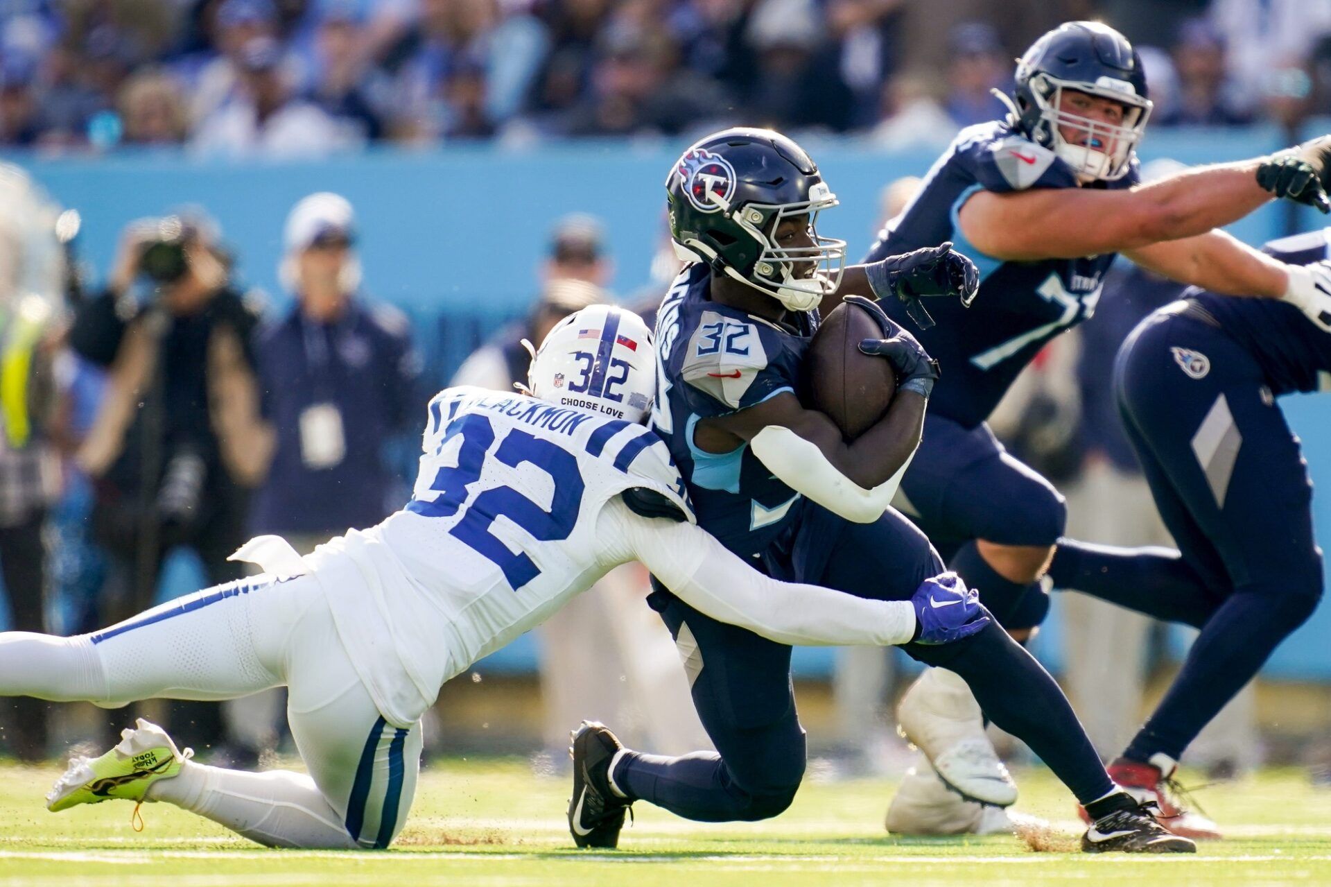Tennessee Titans running back Tyjae Spears (32) is tackled by Indianapolis Colts safety Julian Blackmon (32) during the second quarter at Nissan Stadium in Nashville, Tenn., Sunday, Dec. 3, 2023.