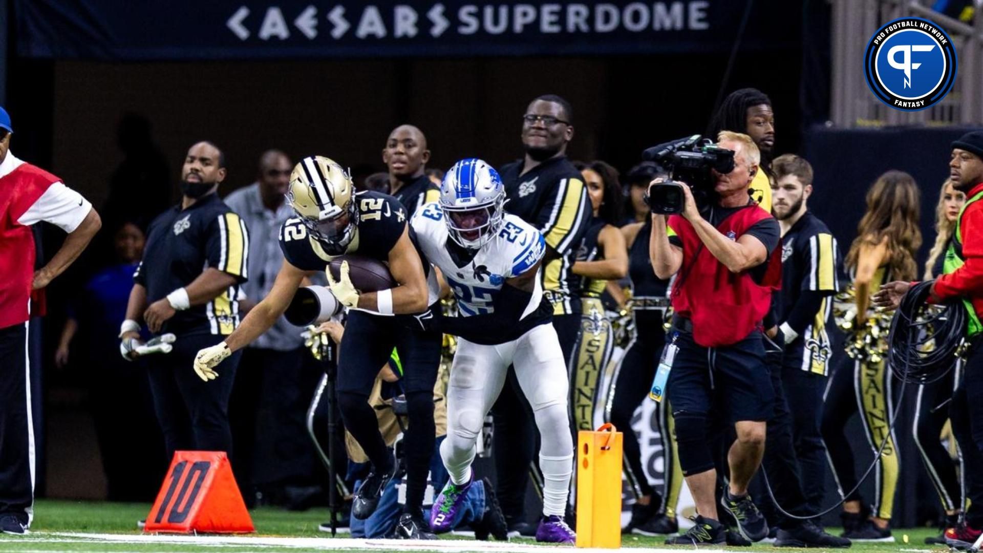 New Orleans Saints wide receiver Chris Olave (12) catches a pass against Detroit Lions cornerback Jerry Jacobs (23) during the first half at the Caesars Superdome.