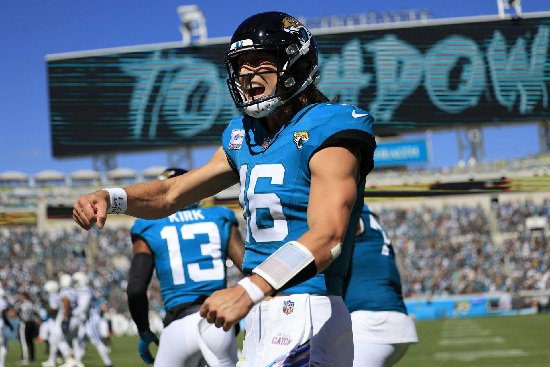 Jacksonville Jaguars QB Trevor Lawrence (16) celebrates after a touchdown.