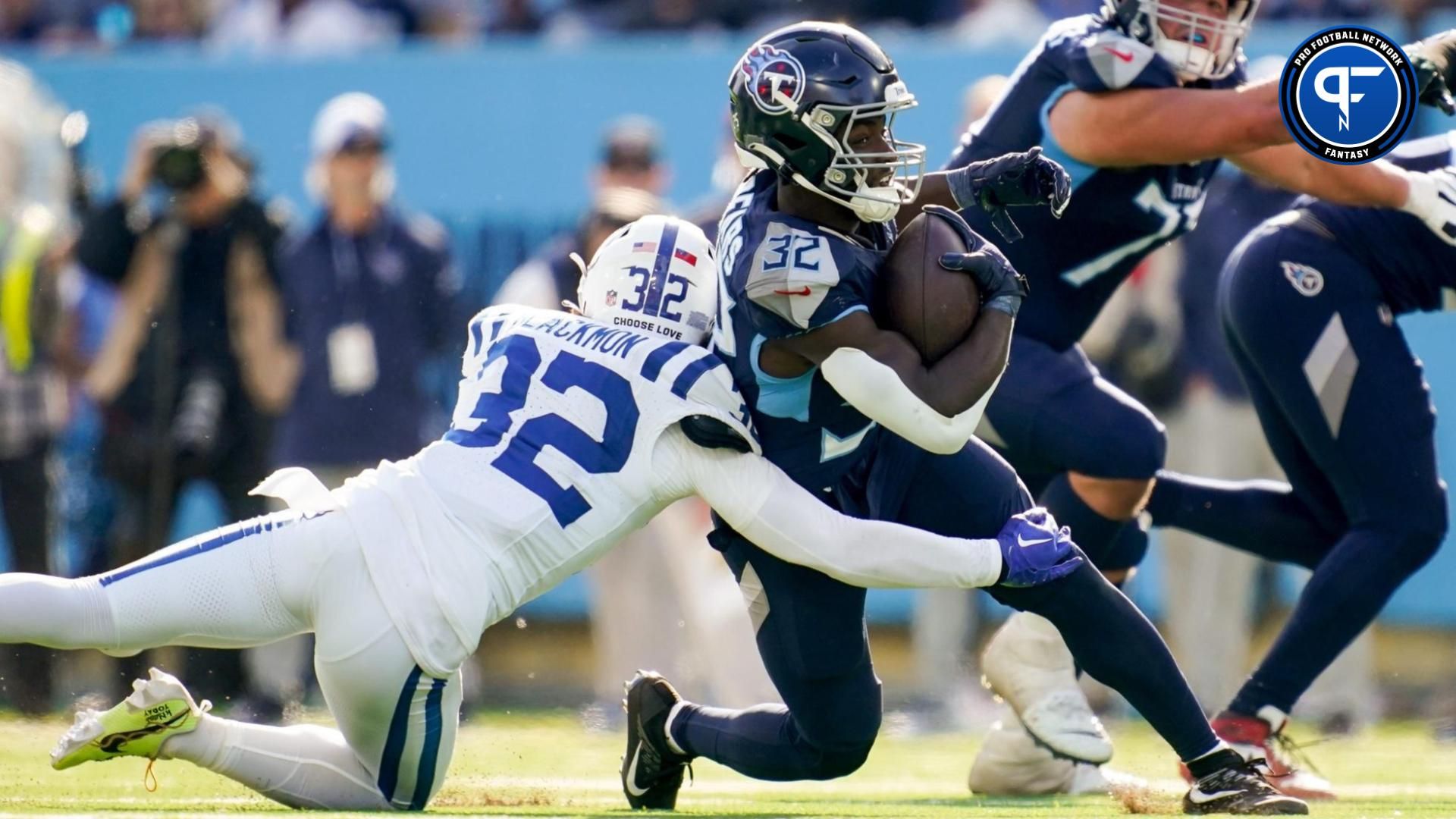 Tyjae Spears (32) is tackled by Indianapolis Colts safety Julian Blackmon (32) during the second quarter at Nissan Stadium.