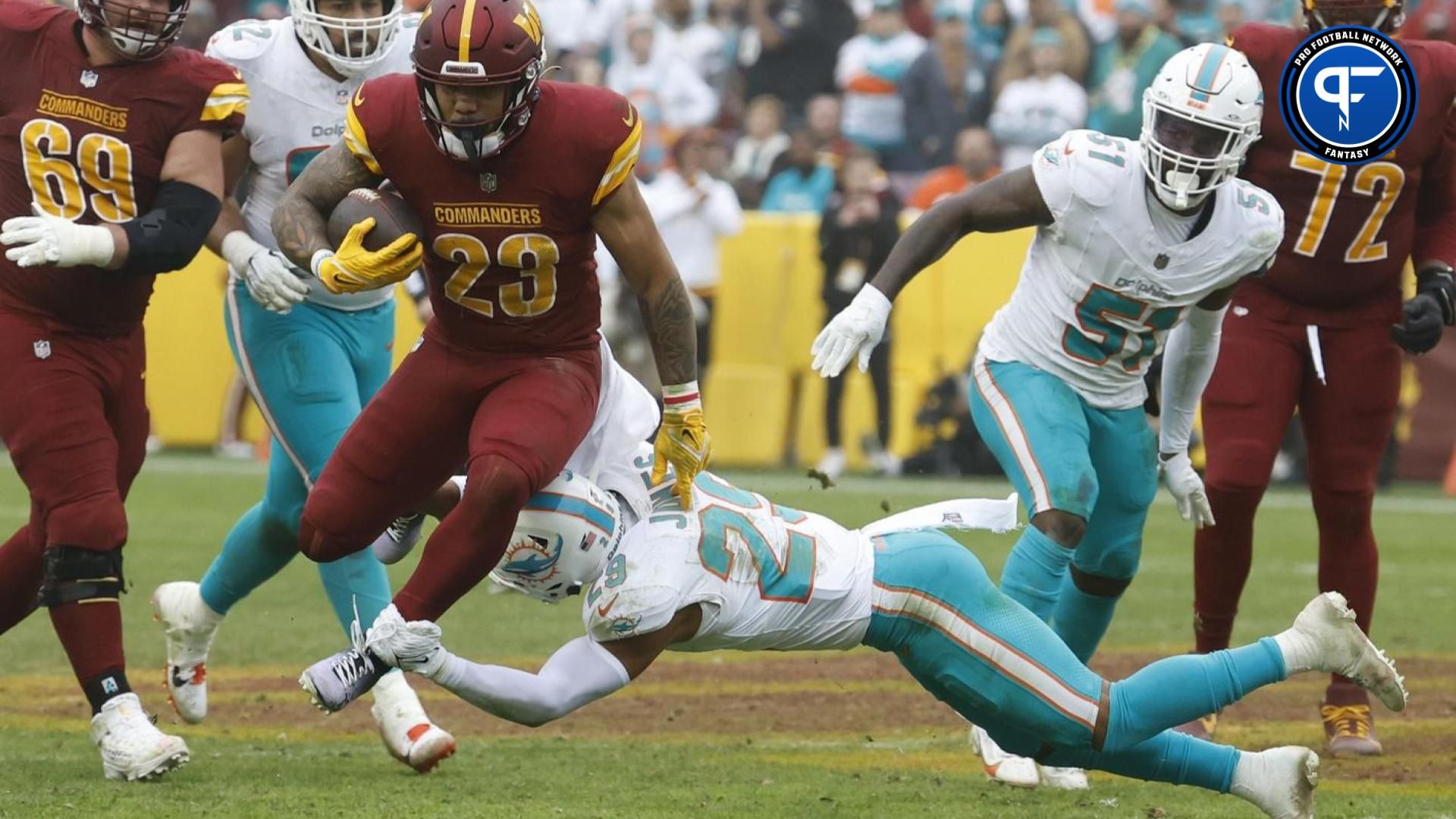 Washington Commanders RB Chris Rodriguez Jr. (23) runs the ball against the Miami Dolphins.