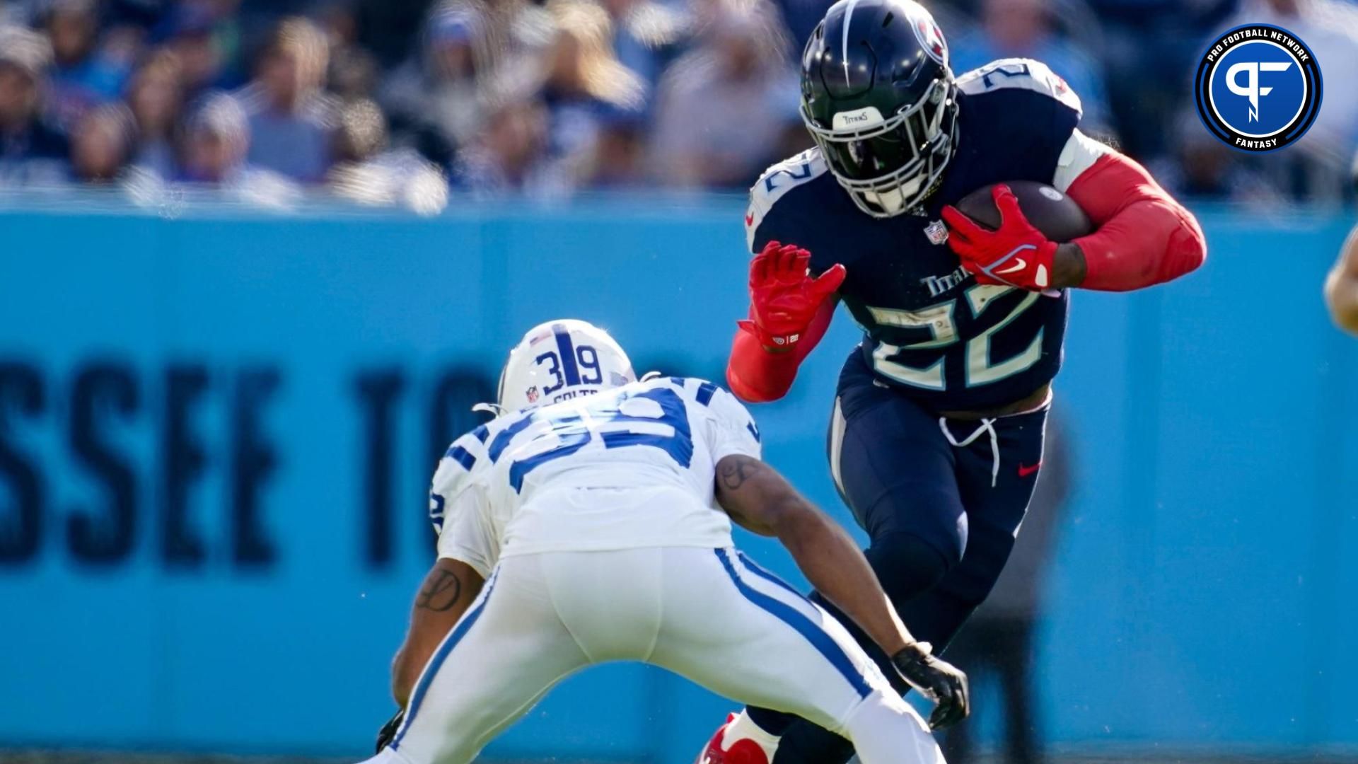 Tennessee Titans running back Derrick Henry (22) evades Indianapolis Colts cornerback Darrell Baker Jr. (39) during the second quarter at Nissan Stadium in Nashville, Tenn., Sunday, Dec. 3, 2023.