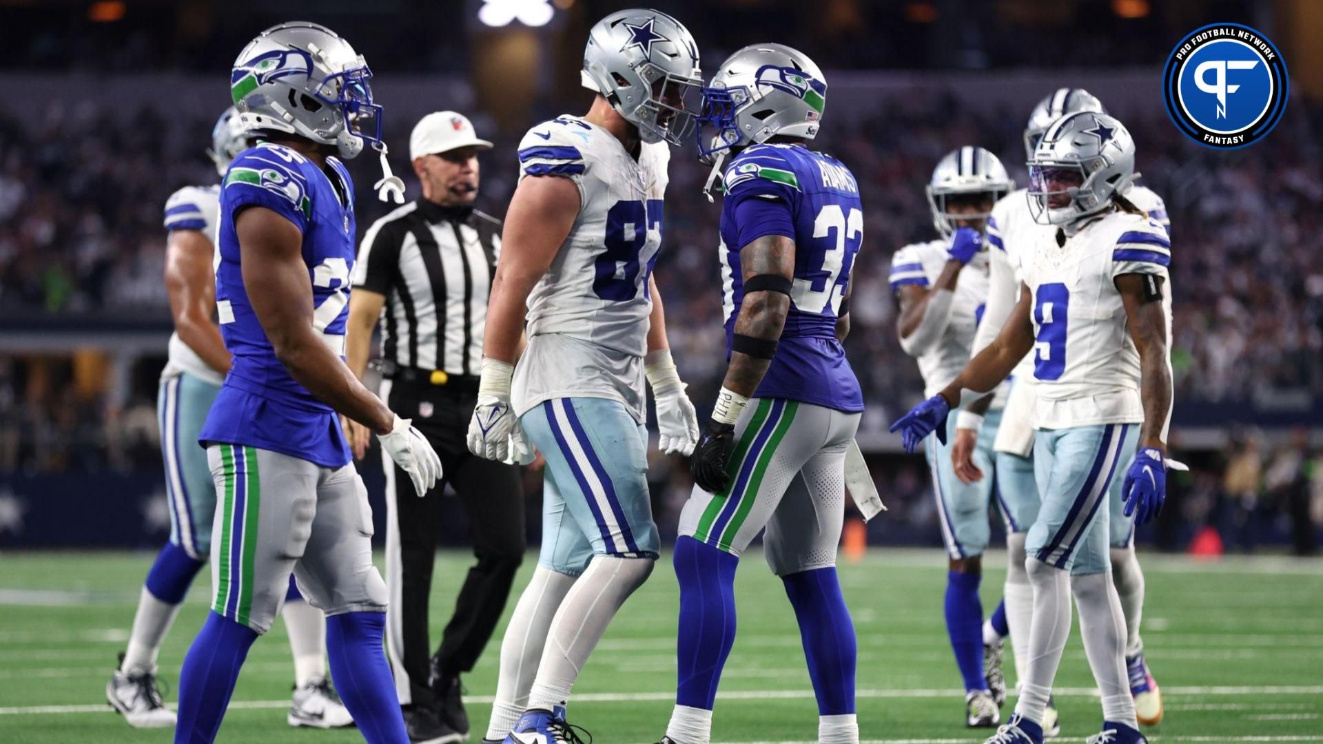 Dallas Cowboys tight end Jake Ferguson (87) and Seattle Seahawks safety Jamal Adams (33) talks after a play during the second half at AT&T Stadium.