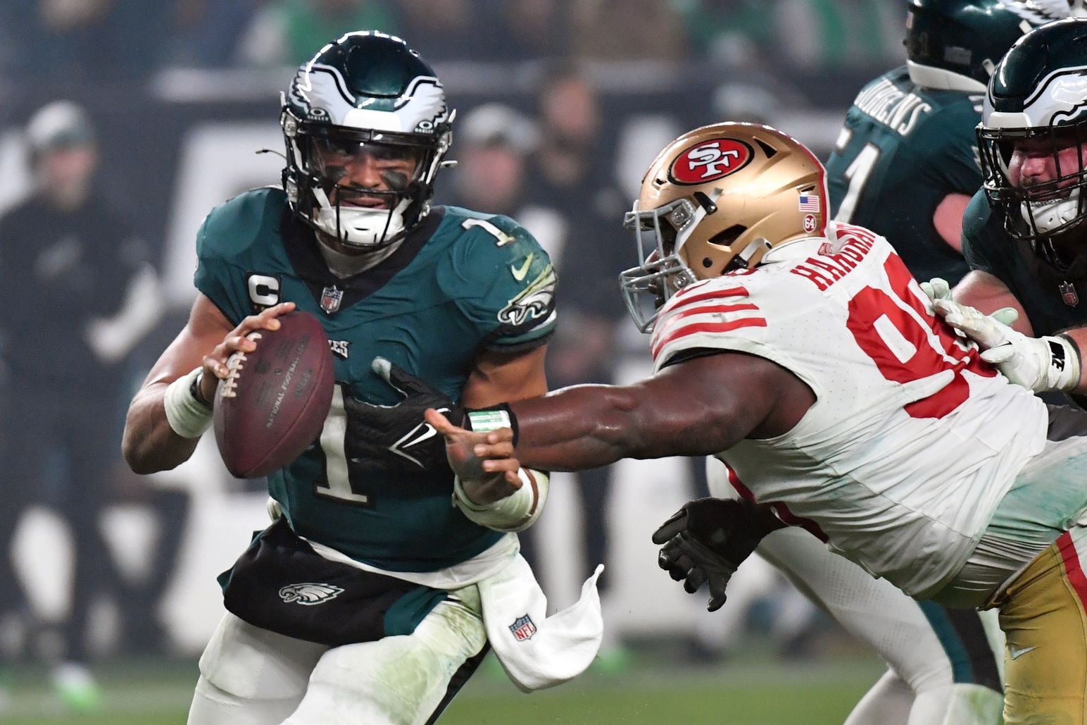 Philadelphia Eagles quarterback Jalen Hurts (1) is tackled by San Francisco 49ers defensive tackle Javon Hargrave (98) during the fourth quarter at Lincoln Financial Field.