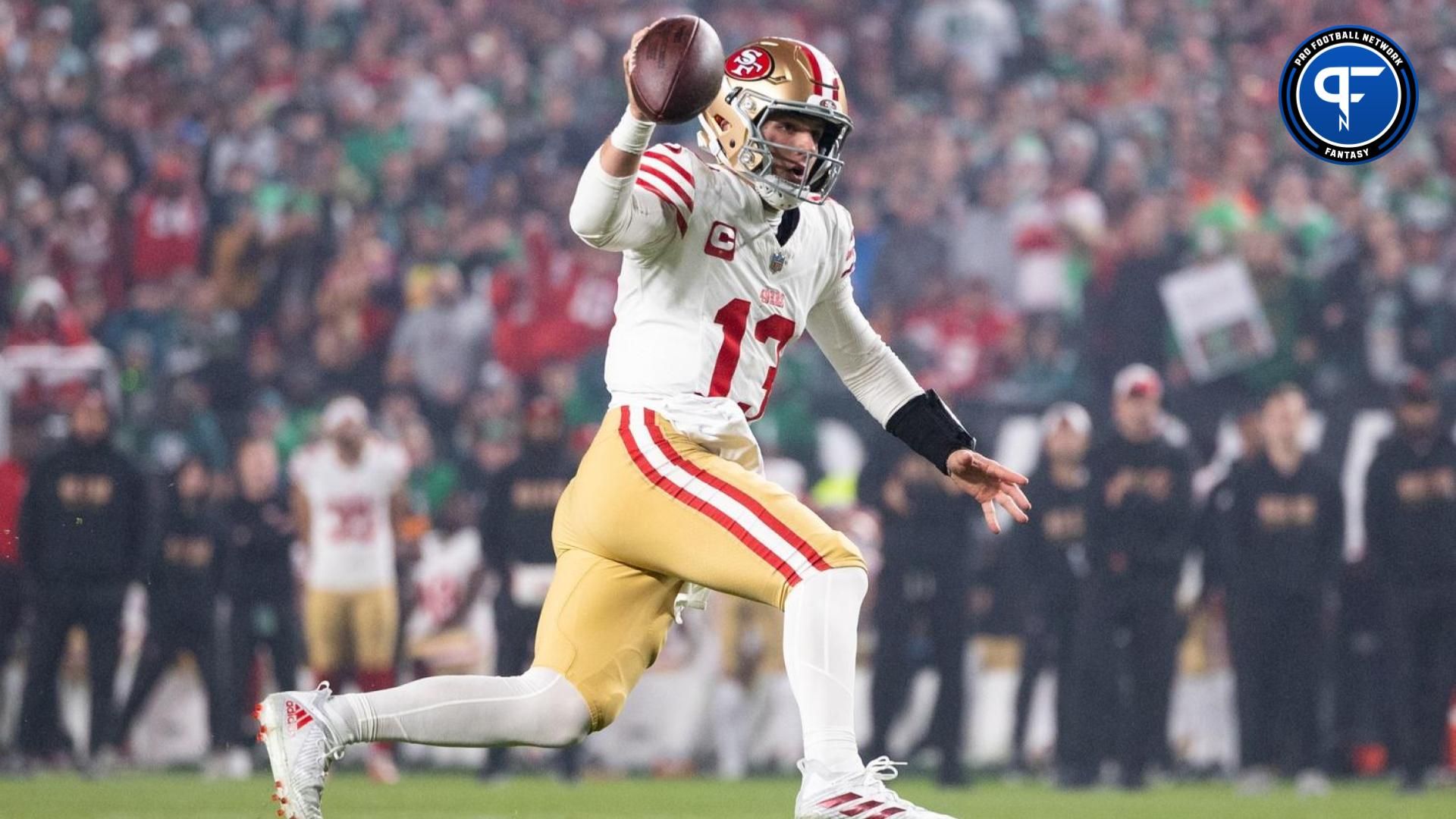 San Francisco 49ers QB Brock Purdy (13) runs with the ball against the Philadelphia Eagles.