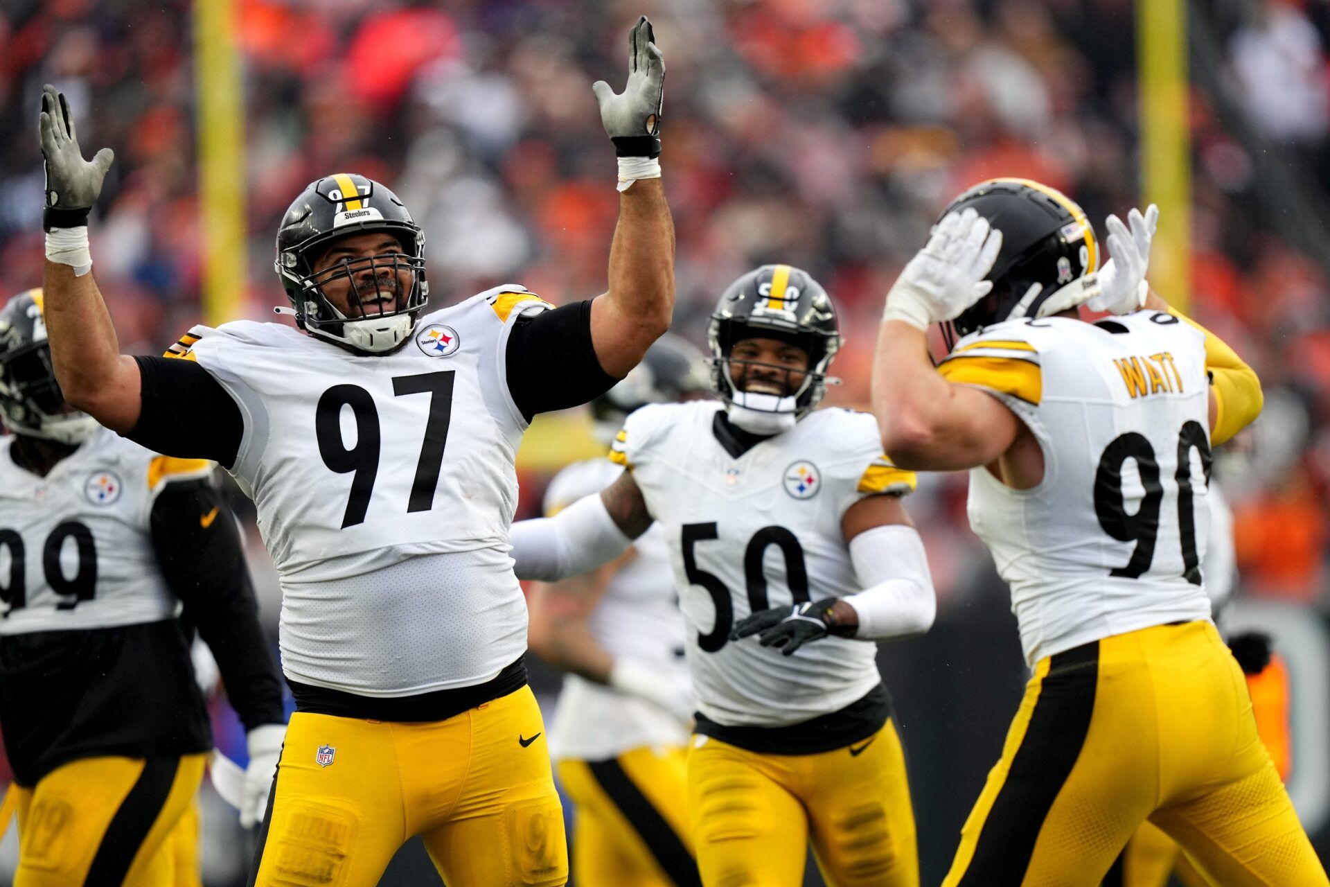 Pittsburgh Steelers defensive tackle Cameron Heyward (97) and Pittsburgh Steelers linebacker T.J. Watt (90) celebrate a sack of Cincinnati Bengals quarterback Jake Browning (6) in the fourth quarter.