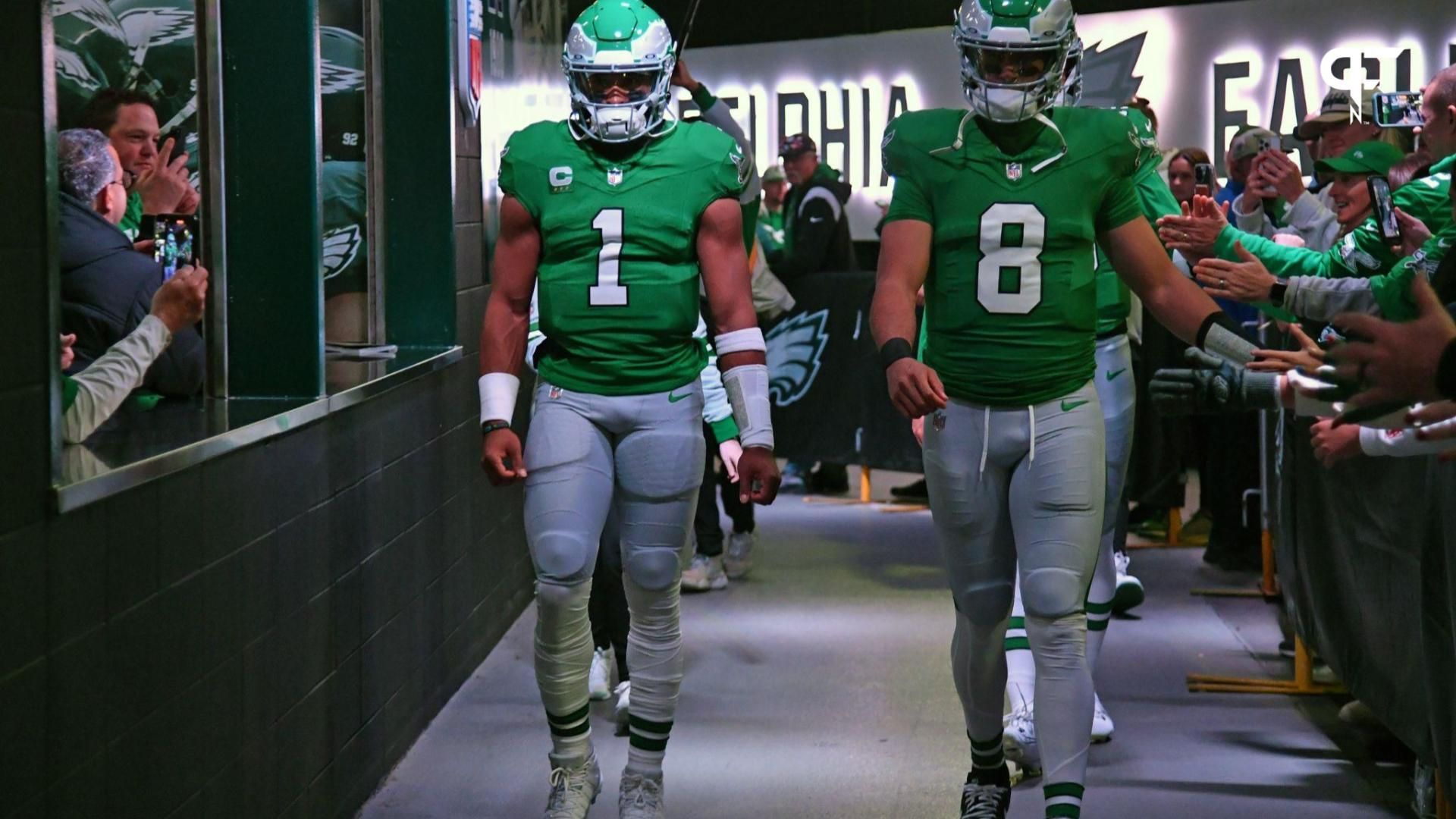 Philadelphia Eagles quarterbacks Jalen Hurts (1) and Marcus Mariota (8) walk out of the tunnel.