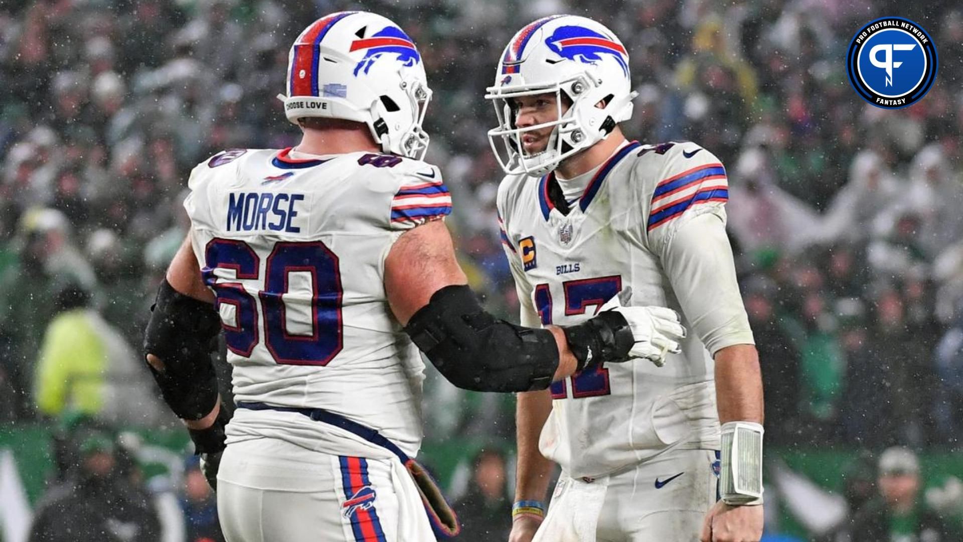 Buffalo Bills center Mitch Morse (60) and quarterback Josh Allen (17) celebrate a touchdown against the Philadelphia Eagles at Lincoln Financial Field.