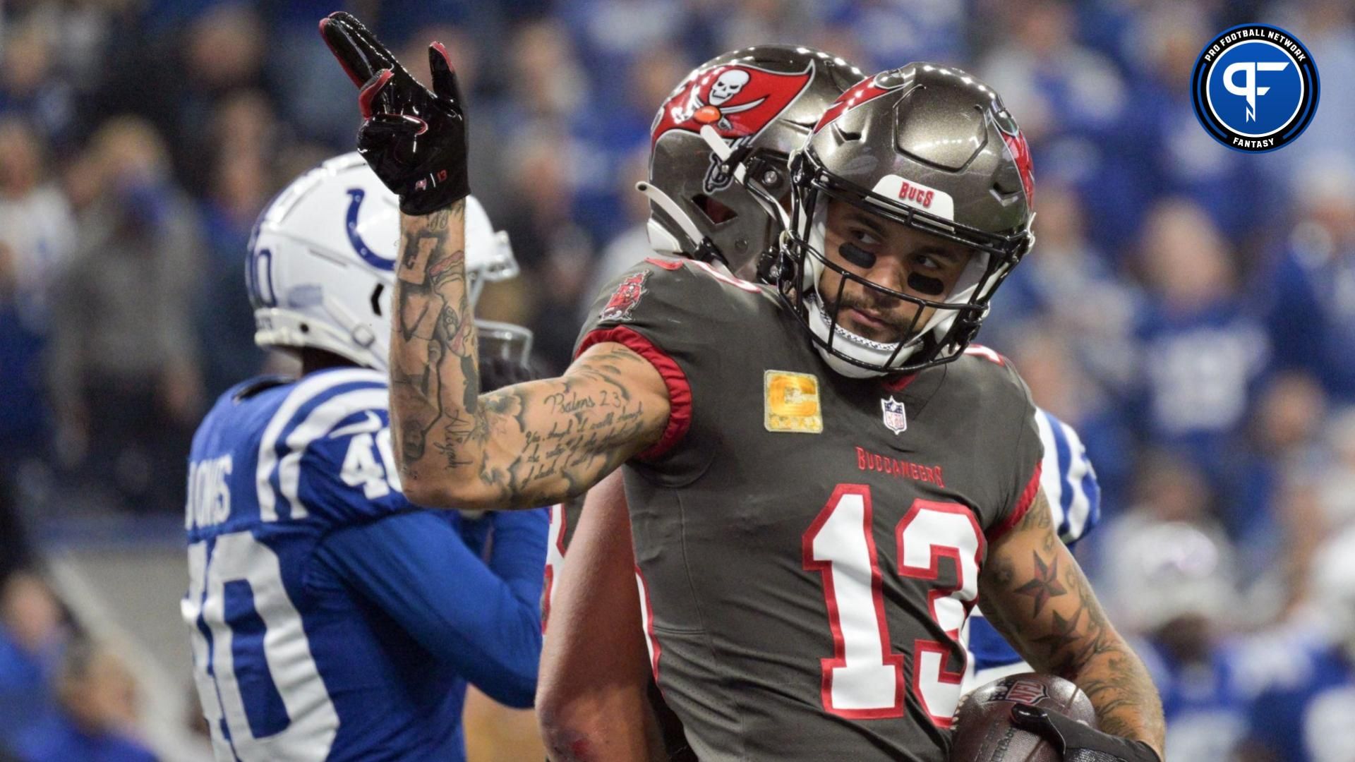 Tampa Bay Buccaneers wide receiver Mike Evans (13) points at the crowd after catching a long pass during the first quarter against the Indianapolis Colts at Lucas Oil Stadium.