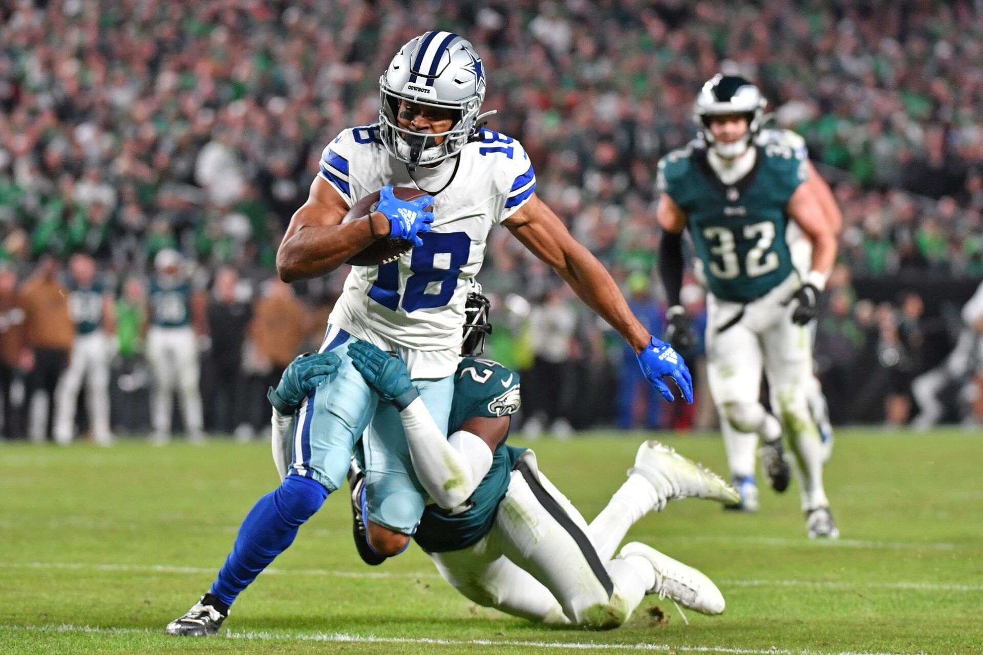 Philadelphia Eagles cornerback James Bradberry (24) tackles Dallas Cowboys wide receiver Jalen Tolbert (18).