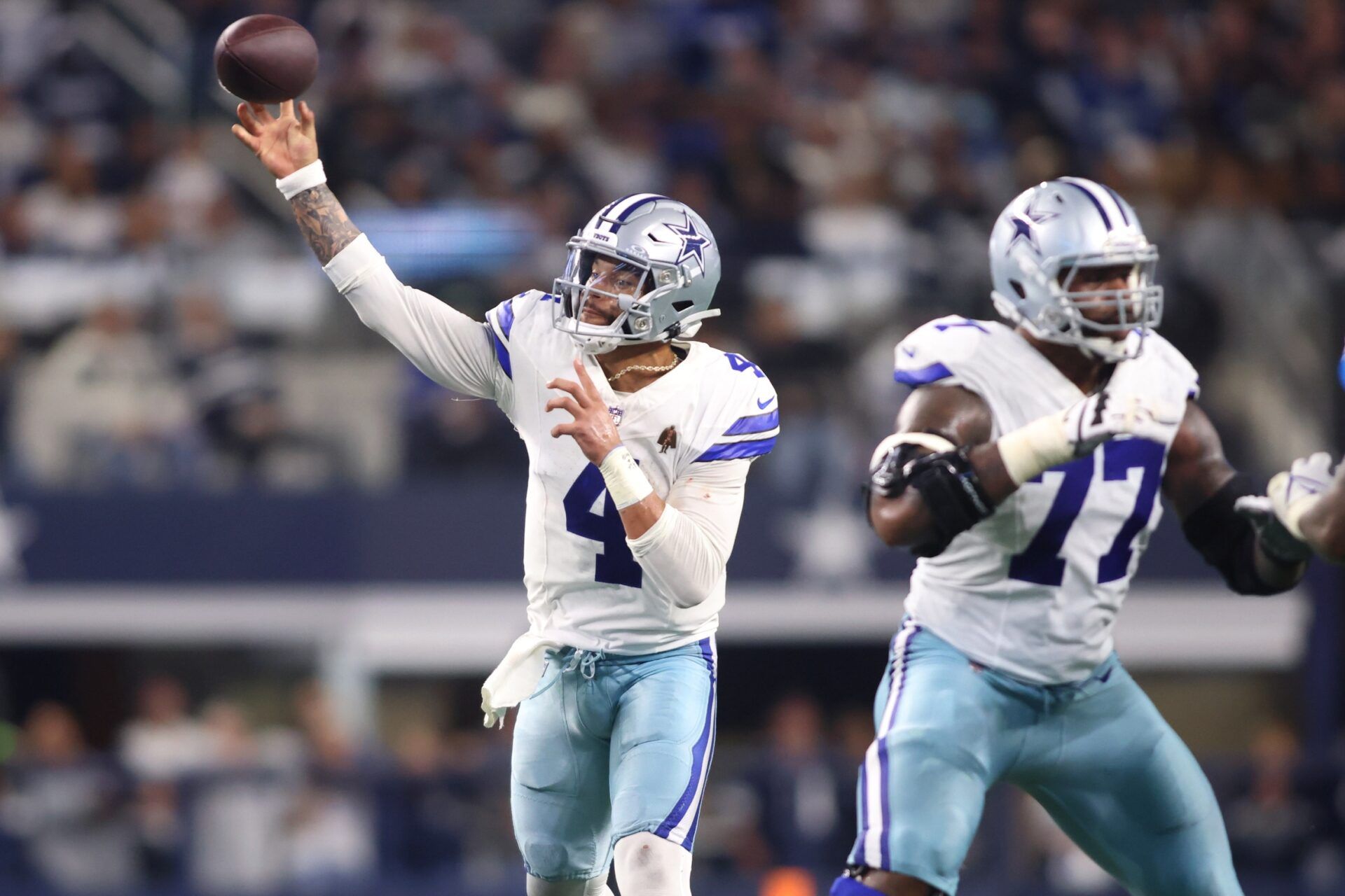 Dallas Cowboys quarterback Dak Prescott (4) throws a pass during the first half against the Seattle Seahawks at AT&T Stadium.