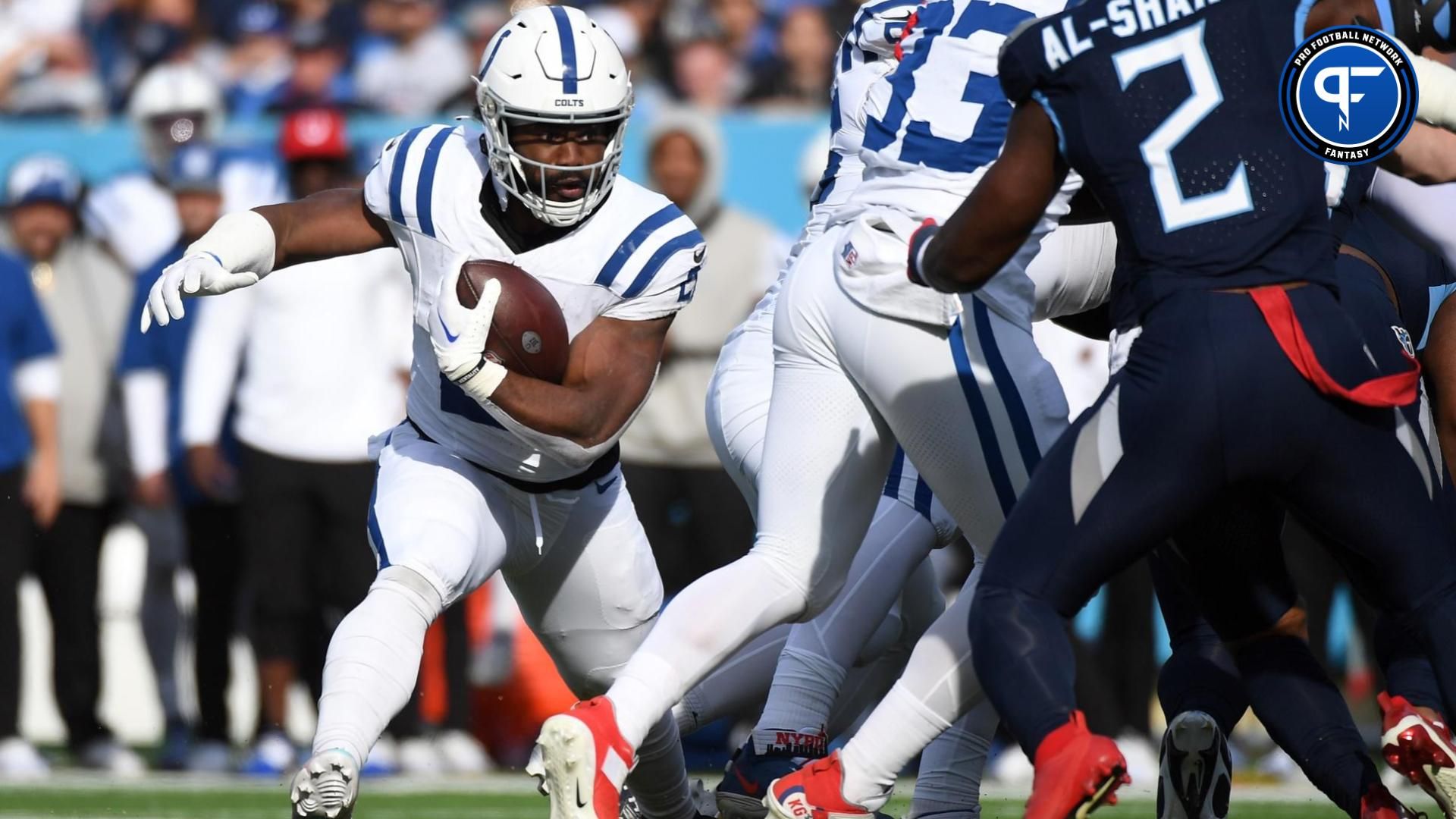 Indianapolis Colts running back Zack Moss (21) is stopped at the line during the first half against the Tennessee Titans at Nissan Stadium.