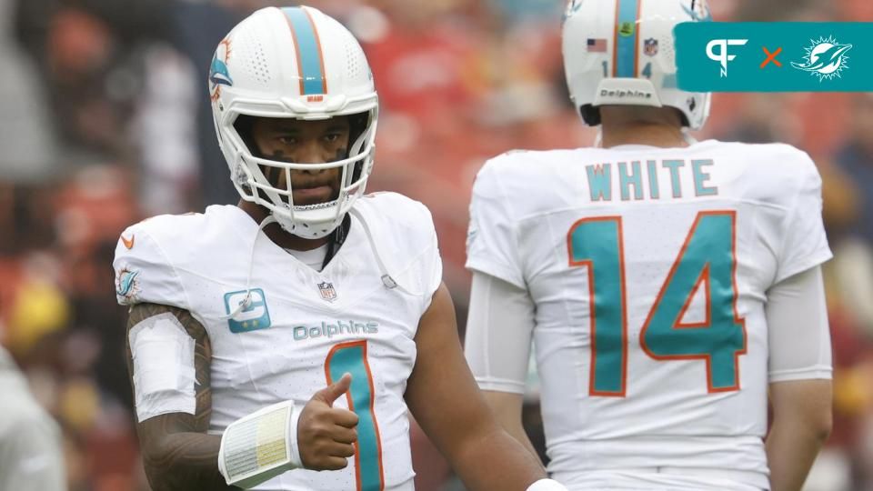 Miami Dolphins quarterback Tua Tagovailoa (1) stands on the field during warm up prior to the game against the Washington Commanders at FedExField.