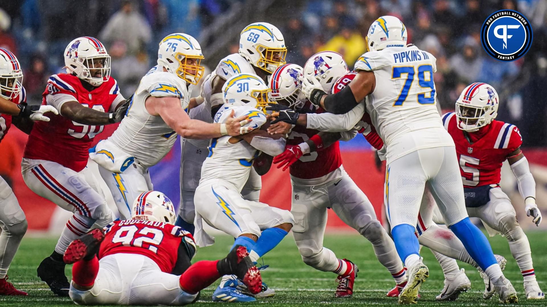 Los Angeles Chargers running back Austin Ekeler (30) runs the ball against the New England Patriots in the second half at Gillette Stadium.