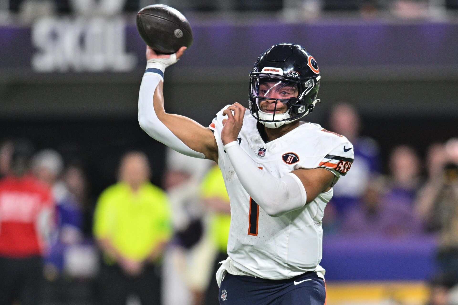 Chicago Bears QB Justin Fields (1) throws the ball against the Minnesota Vikings.