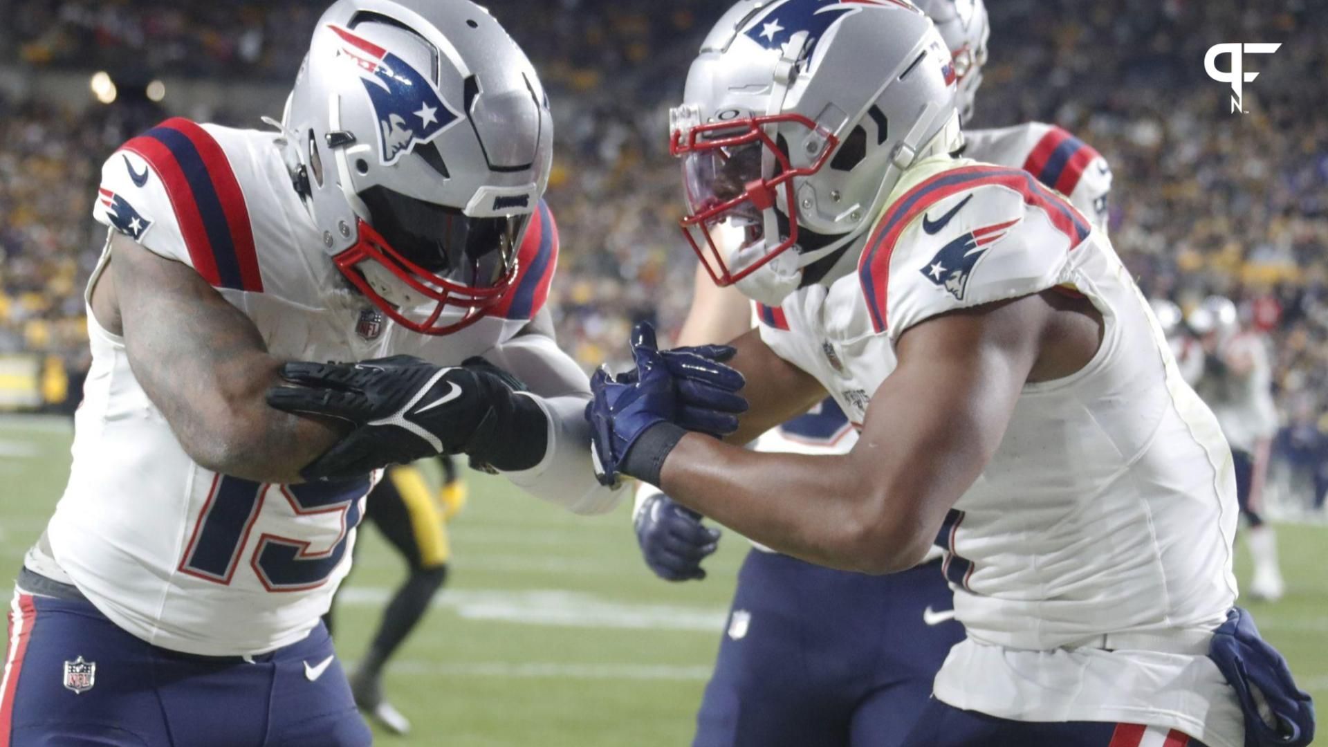 New England Patriots RB Ezekiel Elliott (15) and WR JuJu Smith-Schuster (7) celebrate after Elliott's touchdown.