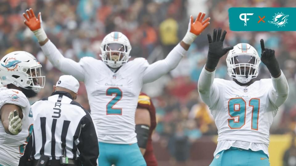 Miami Dolphins defensive end Emmanuel Ogbah (91) celebrates after recording a sack against the Washington Commanders during the second quarter at FedExField.