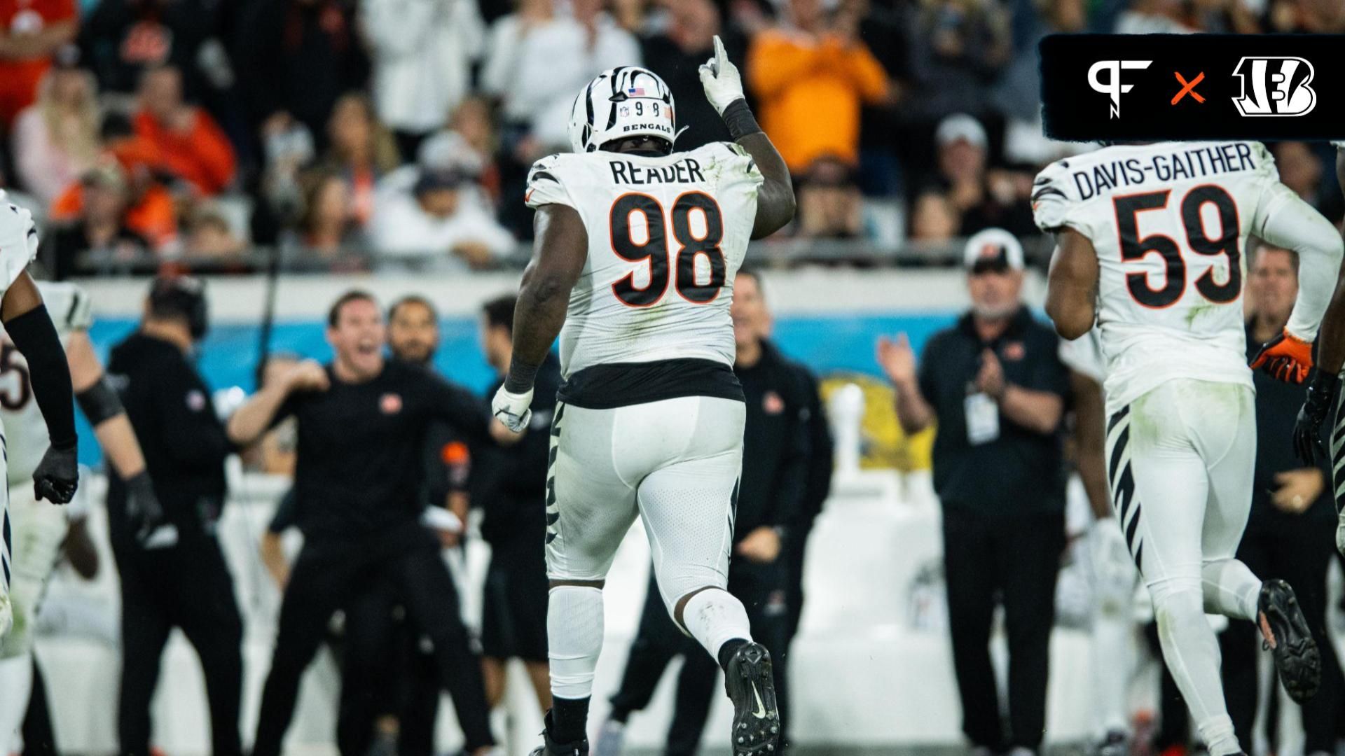 Cincinnati Bengals defensive tackle DJ Reader (98) and linebacker Akeem Davis-Gaither (59) celebrate a turnover against the Jacksonville Jaguars in the fourth quarter at EverBank Stadium.