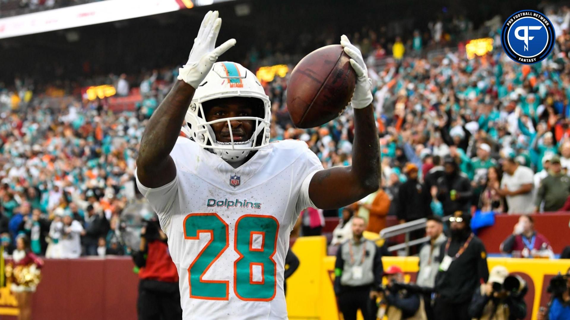 Miami Dolphins running back De'Von Achane (28) celebrates after scoring a touchdown against the Washington Commanders during the second half at FedExField.