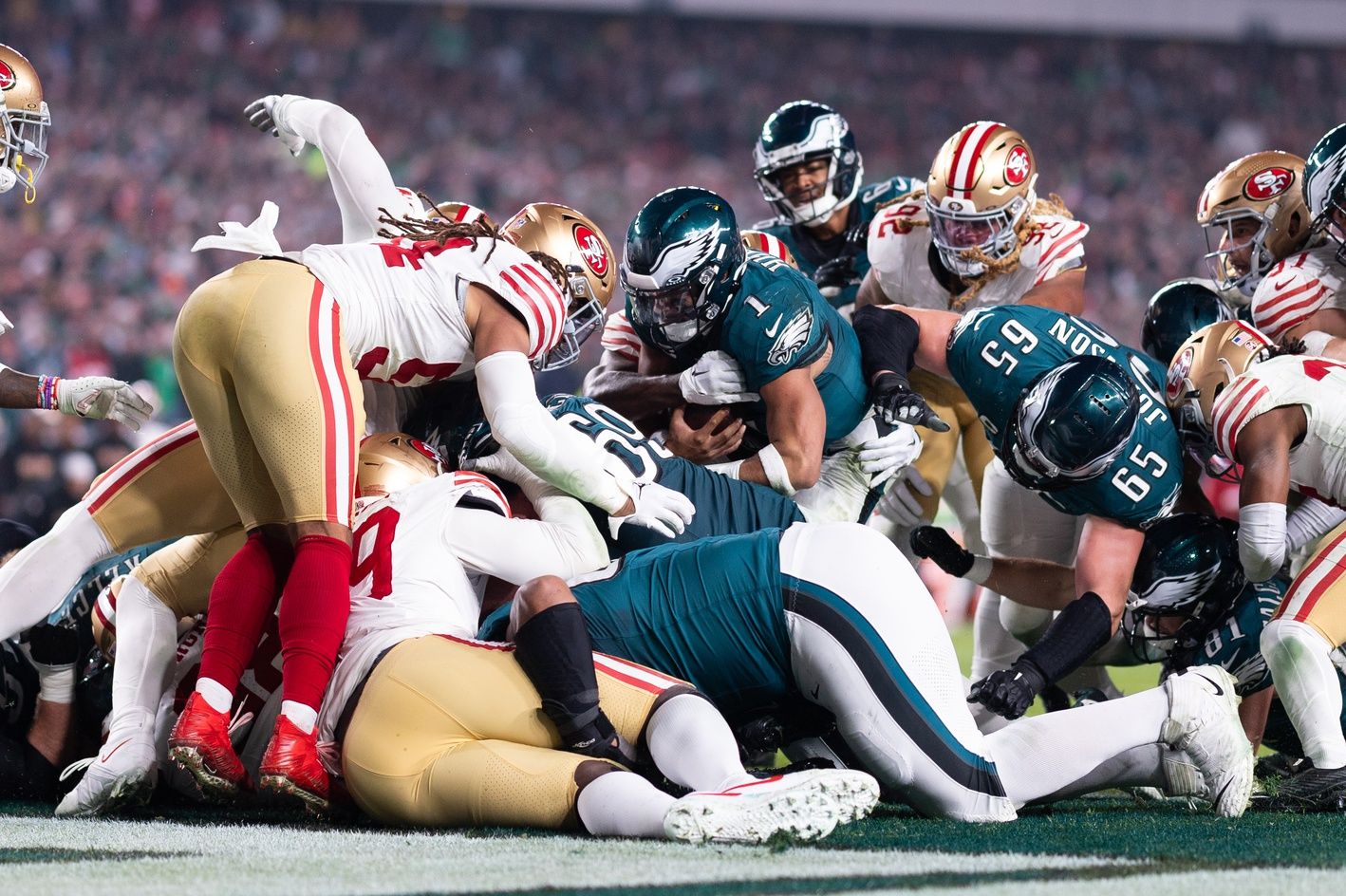 Philadelphia Eagles quarterback Jalen Hurts (1) scores a touchdown on a sneak play against the San Francisco 49ers during the third quarter at Lincoln Financial Field.