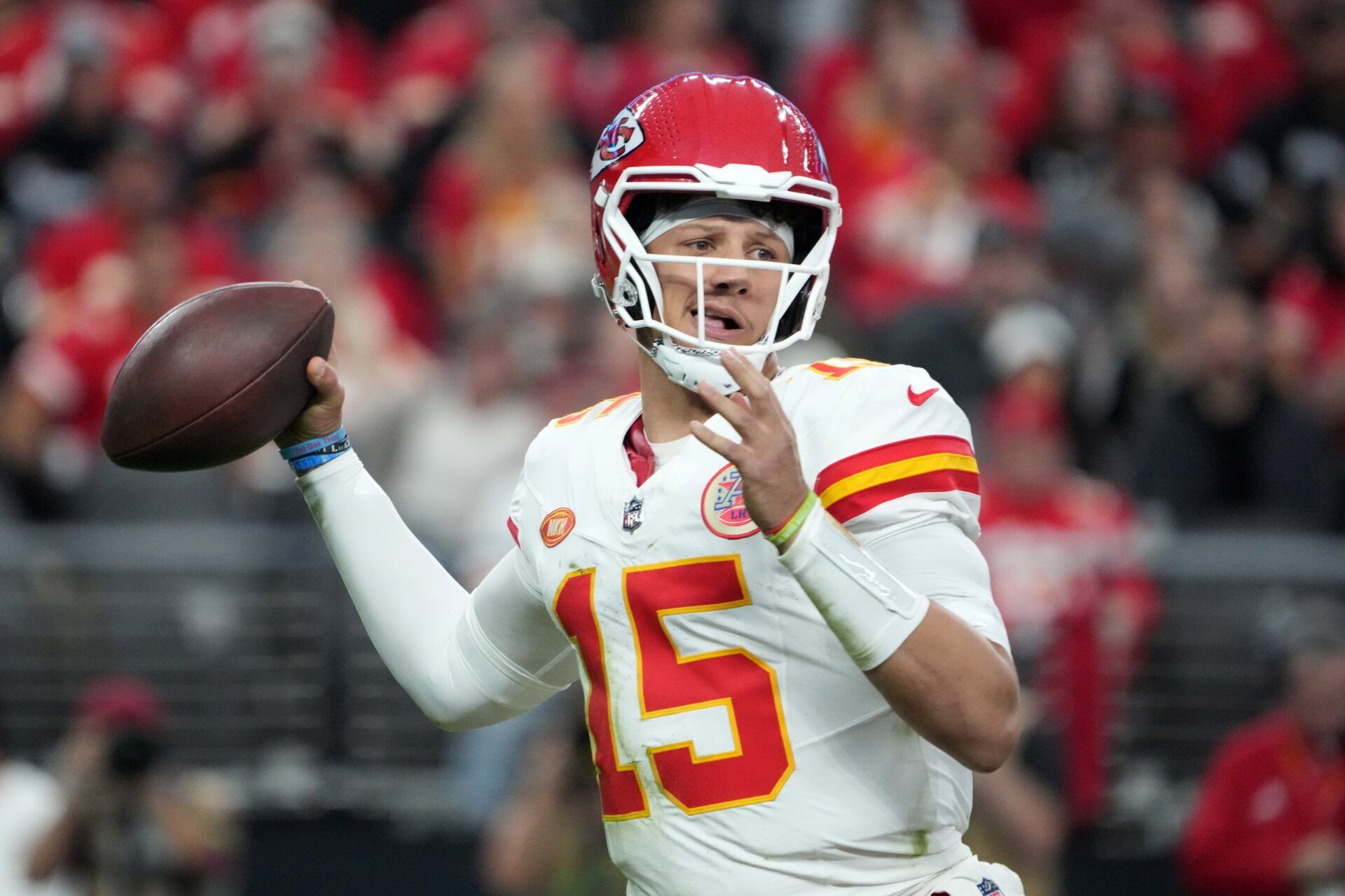 Kansas City Chiefs quarterback Patrick Mahomes (15) throws the ball against the Las Vegas Raiders in the first half at Allegiant Stadium.