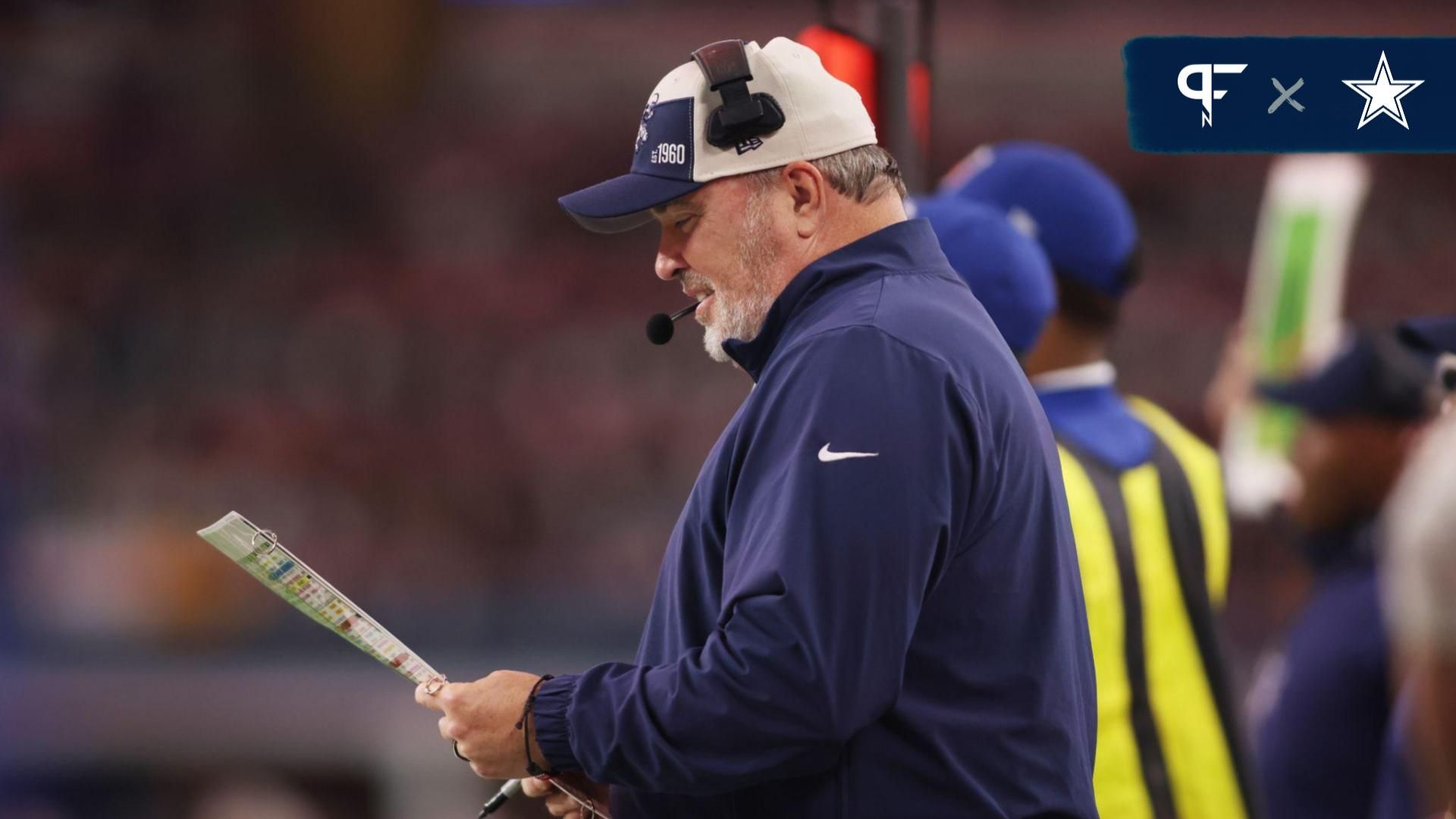 Dallas Cowboys Mike McCarthy looks at the play sheet in then first quarter against the Washington Commanders at AT&T Stadium.