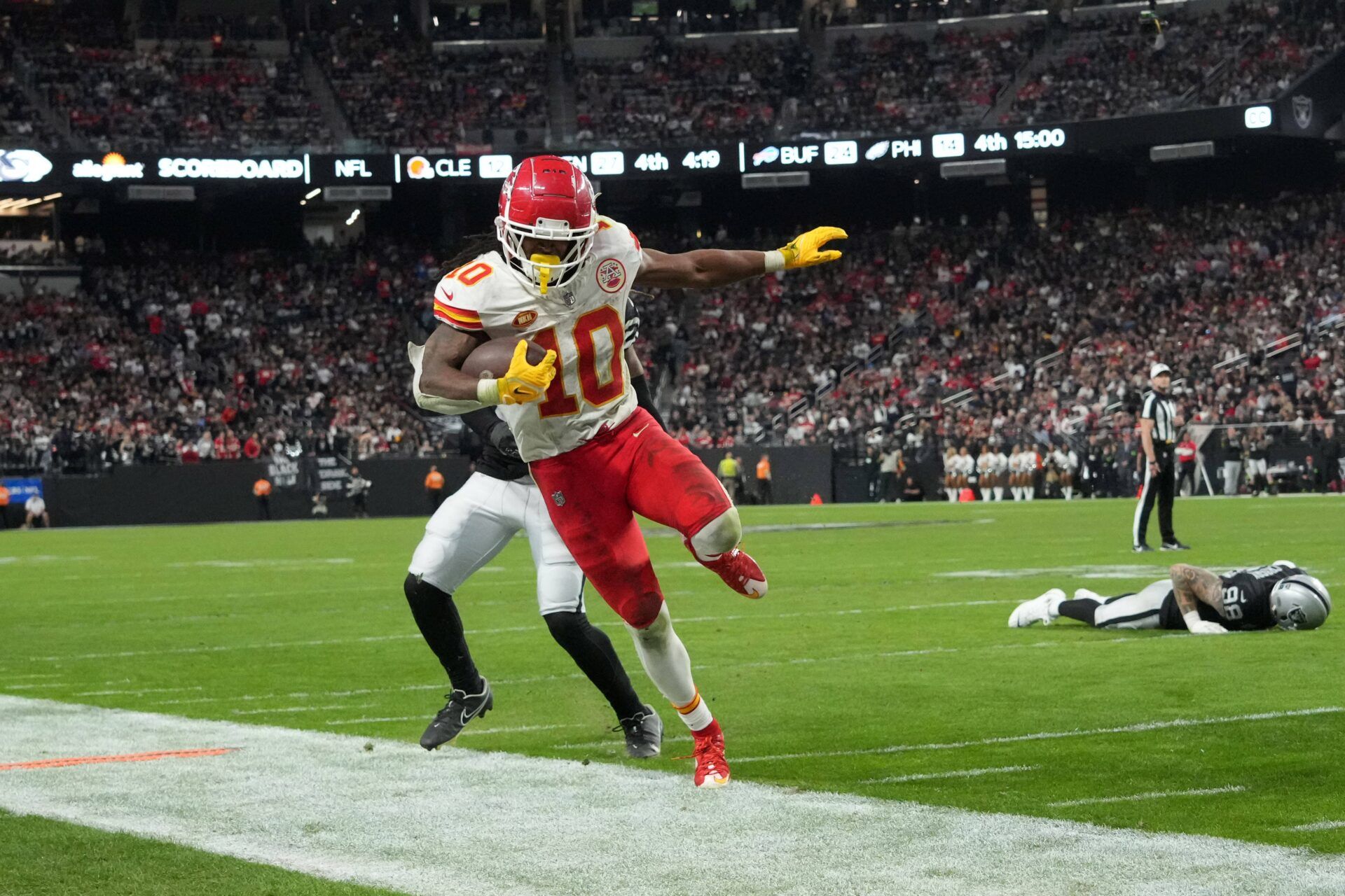 Kansas City Chiefs running back Isiah Pacheco (10) carries the ball against the Las Vegas Raiders in the second half at Allegiant Stadium.