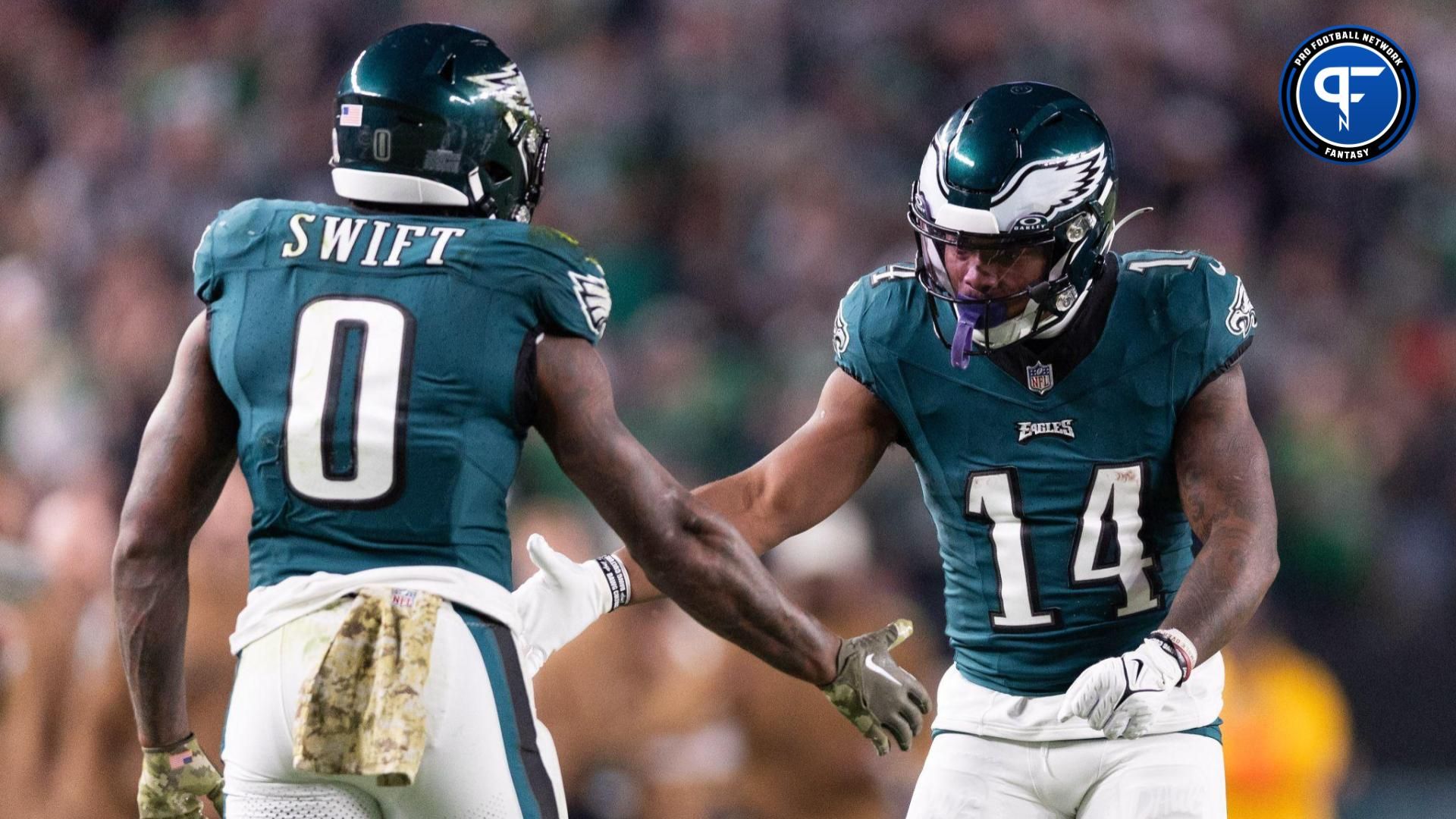 Philadelphia Eagles running back Kenneth Gainwell (14) and running back D'Andre Swift (0) celebrate a play against the Dallas Cowboys during the second quarter at Lincoln Financial Field.