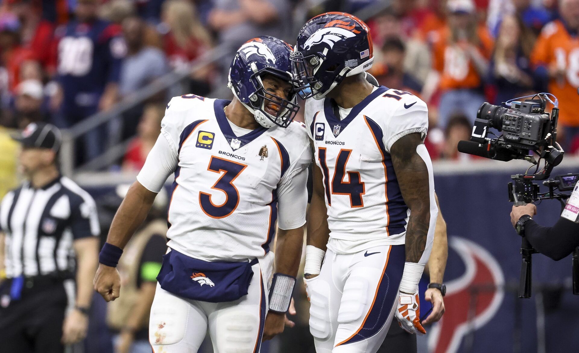 Denver Broncos quarterback Russell Wilson (3) and wide receiver Courtland Sutton (14) celebrate after a touchdown during the third quarter against the Houston Texans at NRG Stadium.