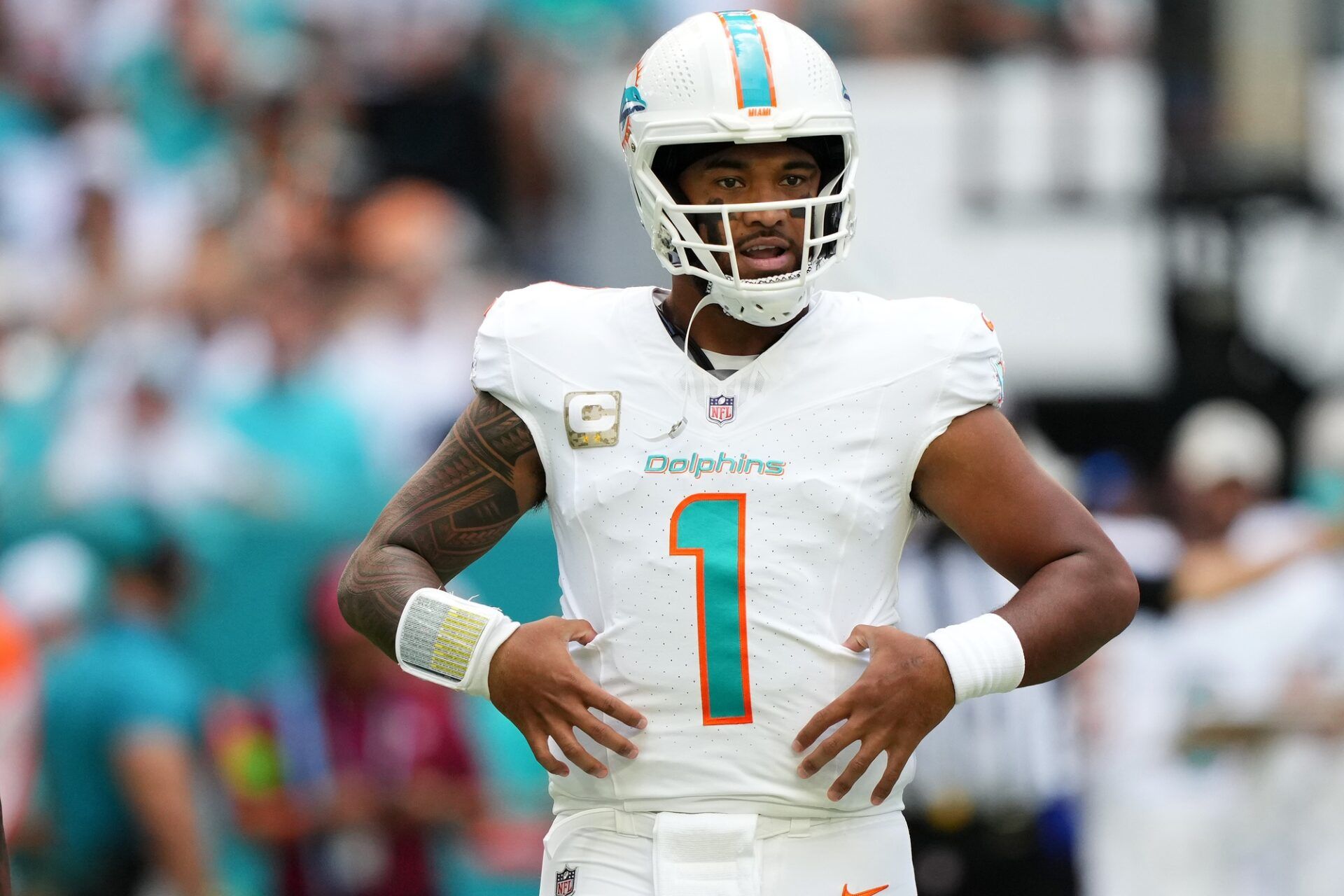 Tua Tagovailoa (1) stands on the field during the first half against the Las Vegas Raiders at Hard Rock Stadium.