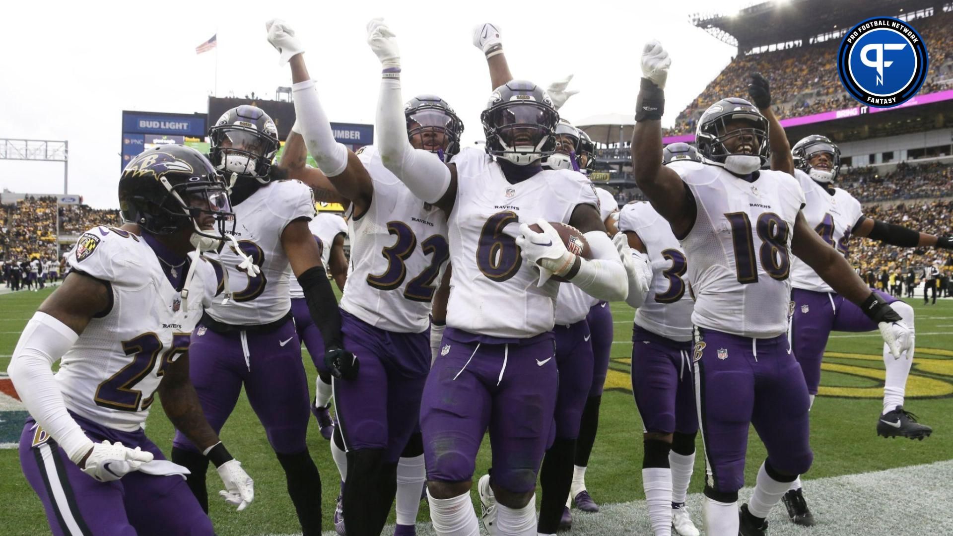 The Baltimore Ravens defense celebrates an interception by linebacker Patrick Queen (6) against the Pittsburgh Steelers during the second quarter at Acrisure Stadium.