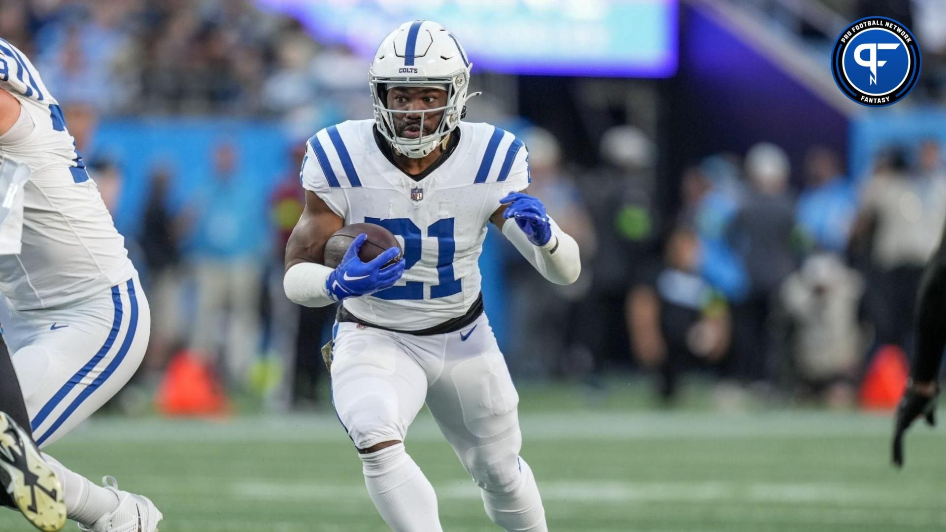 Indianapolis Colts running back Zack Moss (21) runs through an opening against the Carolina Panthers during the first quarter at Bank of America Stadium.