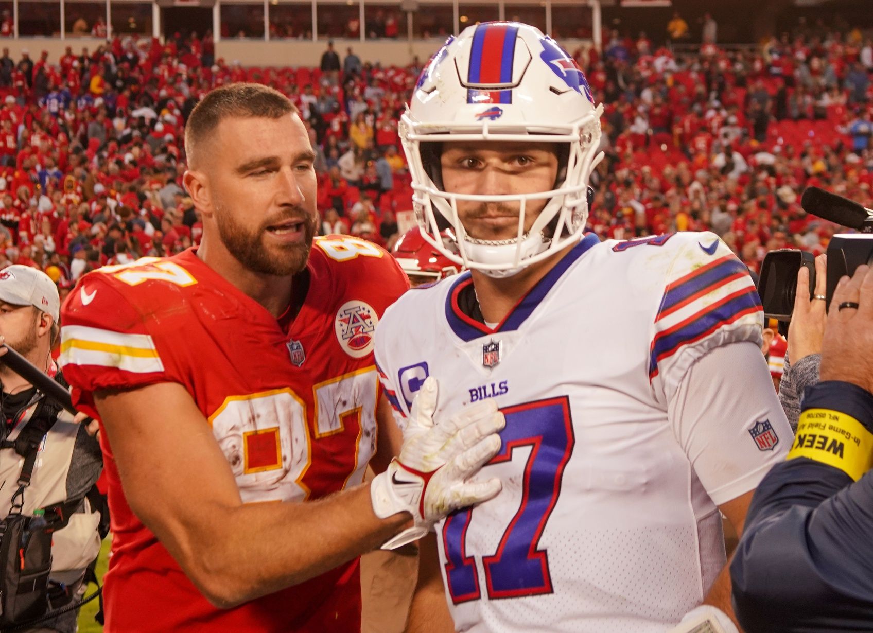 Kansas City Chiefs tight end Travis Kelce (87) talks with Buffalo Bills quarterback Josh Allen (17) after the game at GEHA Field at Arrowhead Stadium.